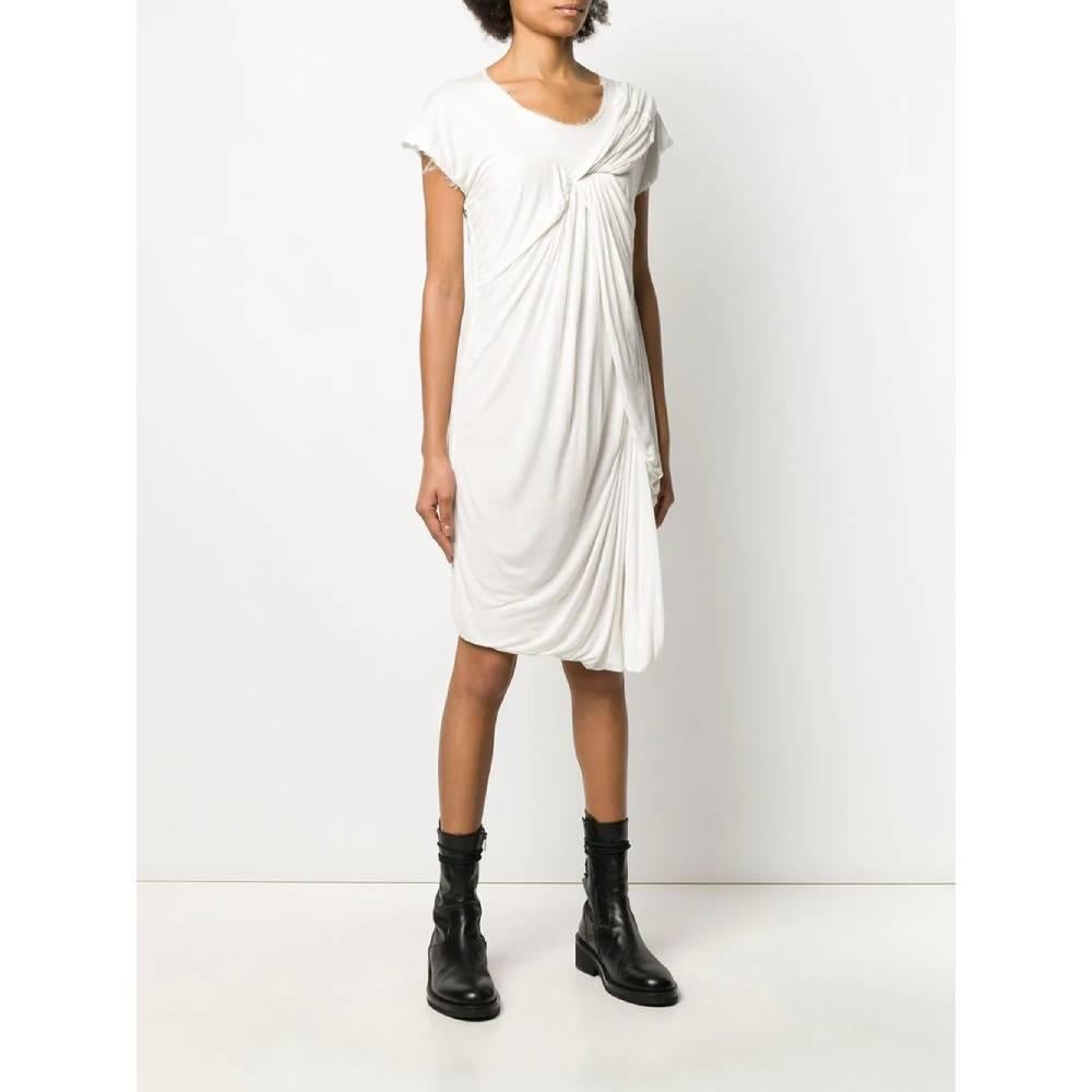 Lanvin white short-sleeved dress. Round neckline, front decorative drapery and fringed edges.

Size: S

Flat measurements
Lenght: 100 cm
Bust: 41 cm
Sleeves: 14 cm
Product code: A5407

Composition: 
Outer: 100% Viscose
Lining: 100% Silk

Made in: