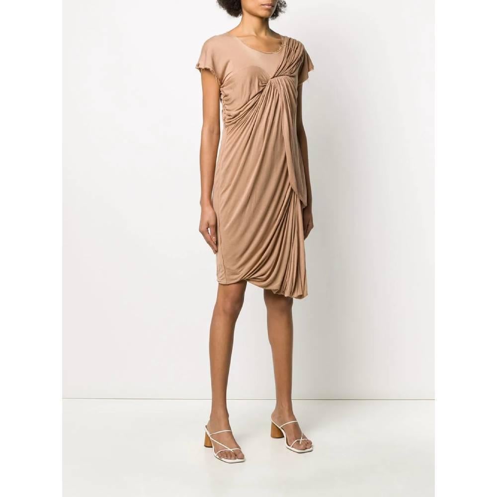 Lanvin beige short-sleeved dress. Round neckline, front decorative drapery and fringed edges.

Size: XS

Flat measurements
Lenght: 100 cm
Bust: 40 cm
Sleeves: 14 cm

Product code: A5405

Composition: 
Outer: 100% Viscose
Lining: 100% Silk

Made in:
