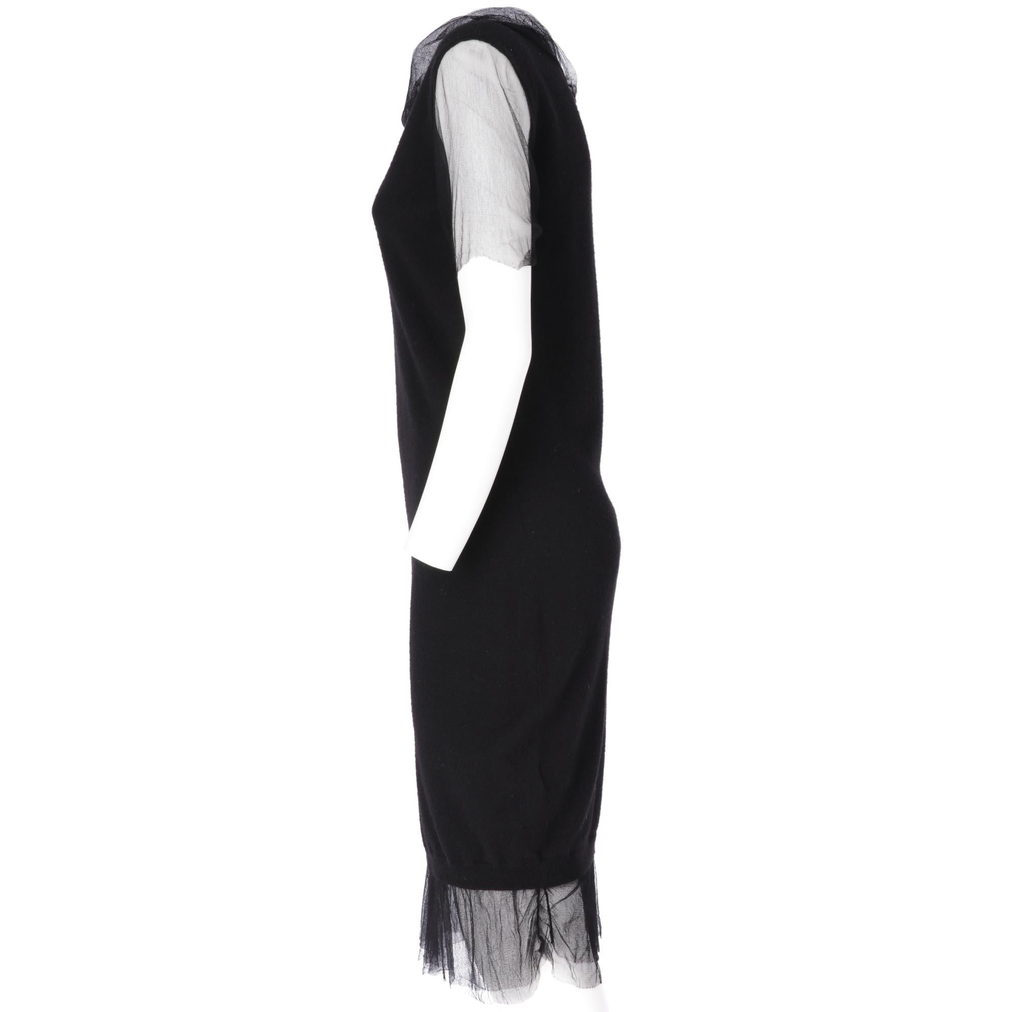Lanvin black midi dress in virgin wool, round neck, short tulle sleeves, tulle layer applied on the hem and on the neck.

Years: Winter 2009

Made in Italy

Size: M

Linear measures

Height: 103 cm
Bust: 44 cm 
Waist: 41 cm
Shoulders: 45 cm 