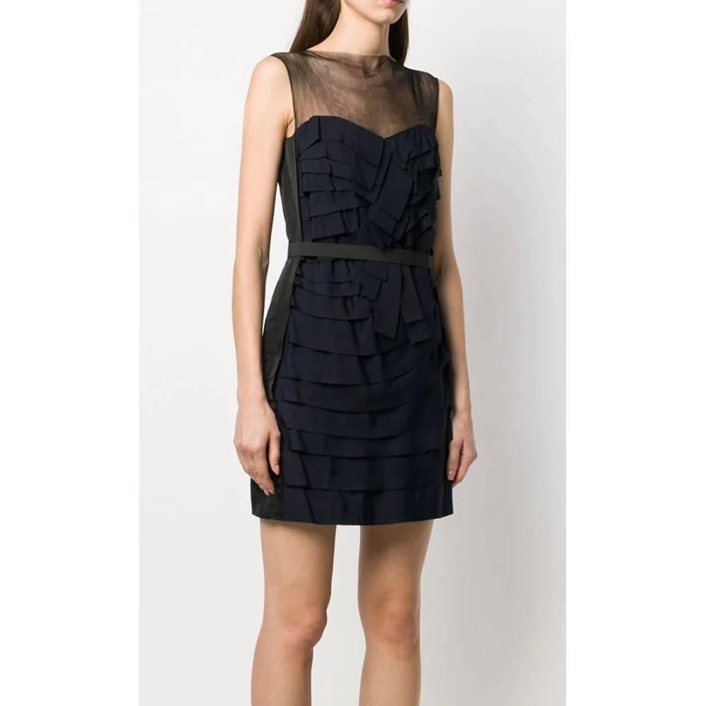 Lanvin sleeveless short dress in dark navy blue silk. Model with slim fit, front decorative pleated detail, transparent upper part with round neck, waist with belt, back closure with hidden zip.

Years: 2008

Made in France

Size: 36 FR

Linear
