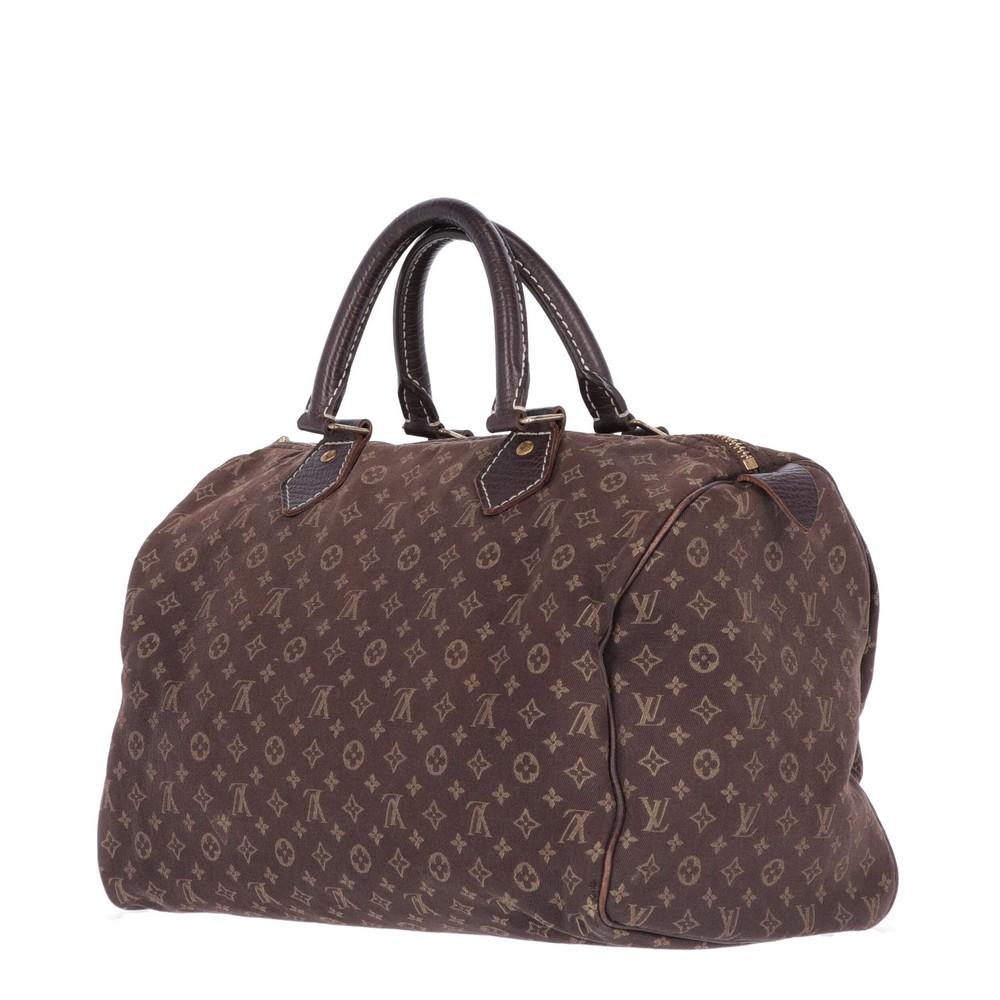 Louis Vuitton brown monogram canvas bag and finished edges. Two leather handles and golden metal details. The item is vintage, it shows light signs of wear as shown in the pictures. 

Years: 2000s 

Made in Italy 

Height: 21 cm 
Width: 30 cm