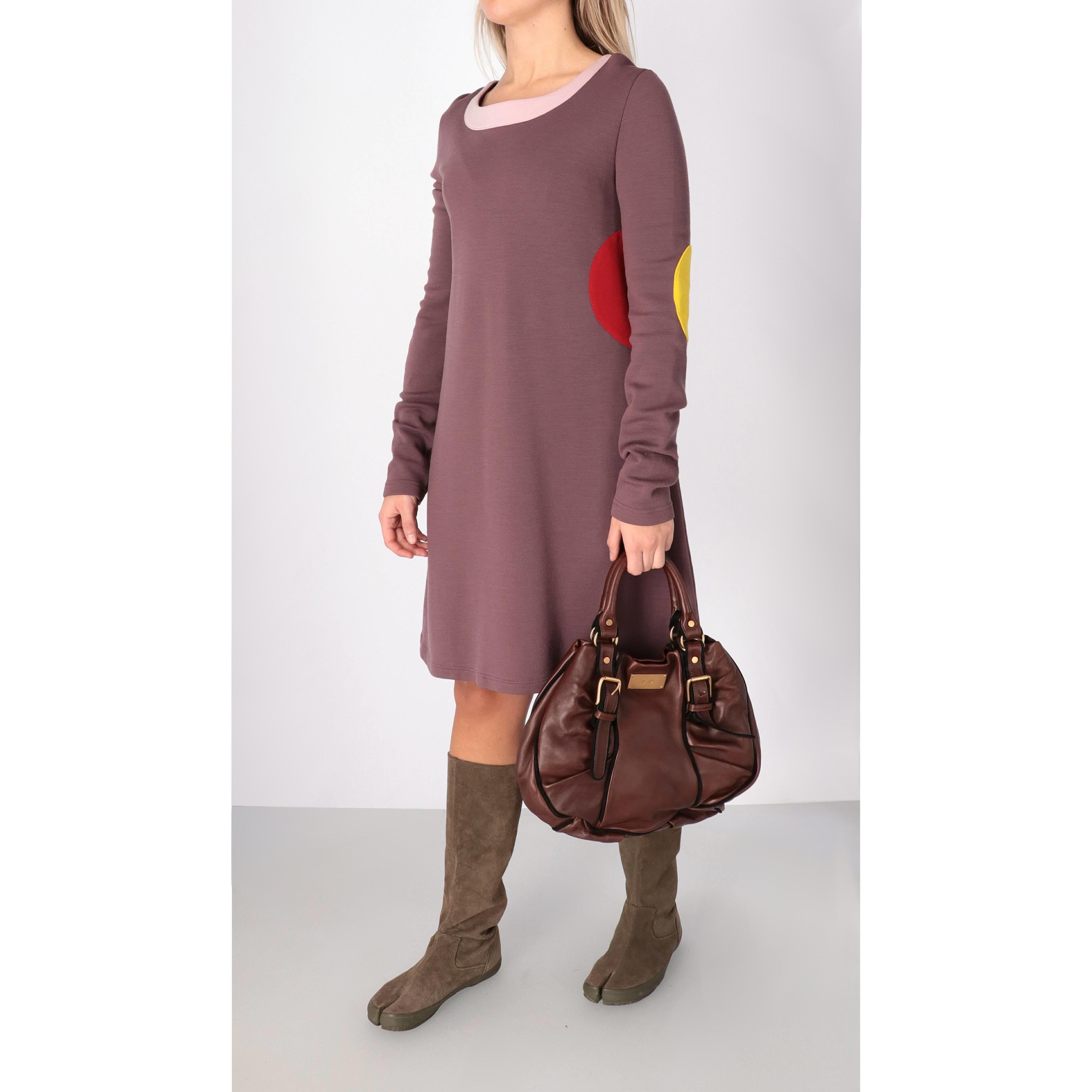 Marni mauve wool blend dress with yellow and red patches appliqué. Straight cut with round neckline and long sleeves.

Size: 46 IT

Flat measurements
Height: 92 cm
Bust: 47 cm
Shoulders: 42 cm
Sleeves: 68 cm

Product code: X0057

Notes: The product
