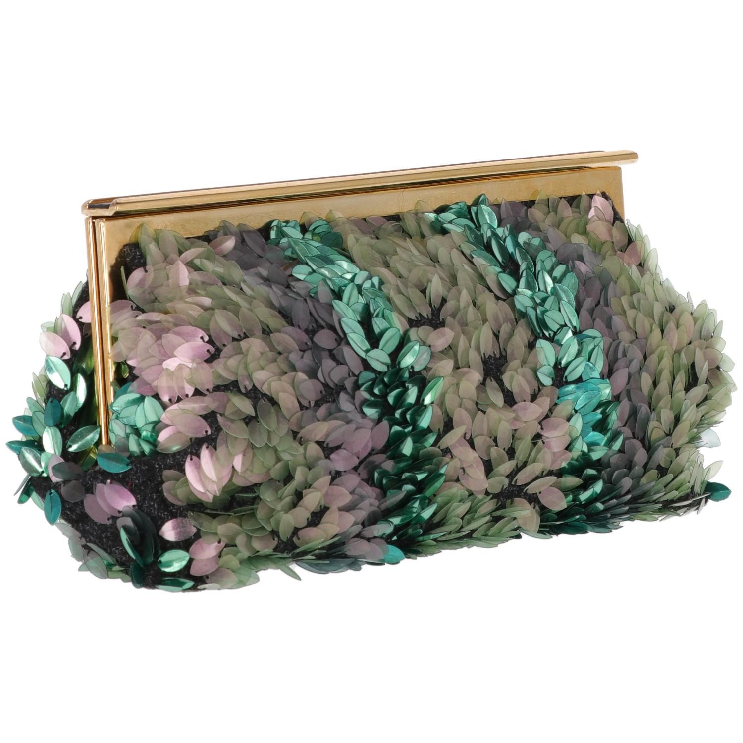 Marni black fabric clutch bag covered with lilac and green leaf-shaped sequins. Golden metal and black leather insert snap closure. Beige cotton interior with brown leather inserts and two patch pockets.

Width: 30 cm
Hight: 20 cm
Depth: 6