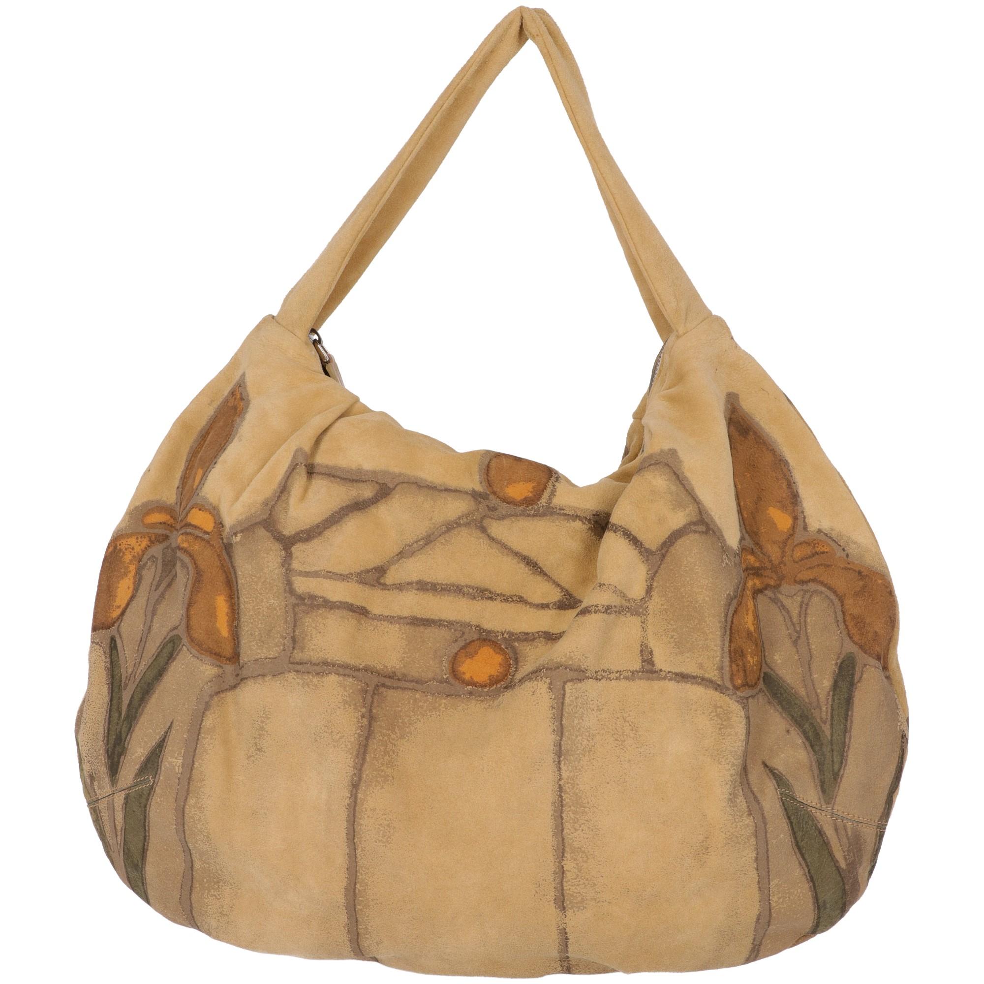 The stylish Marni beige suede handbag with grey, yellow and teal colored fancy print, features a zip fastening and a suede handle. The bag is lined, with an inner zip pocket.
The item shows small stains on the lining, as shown in the