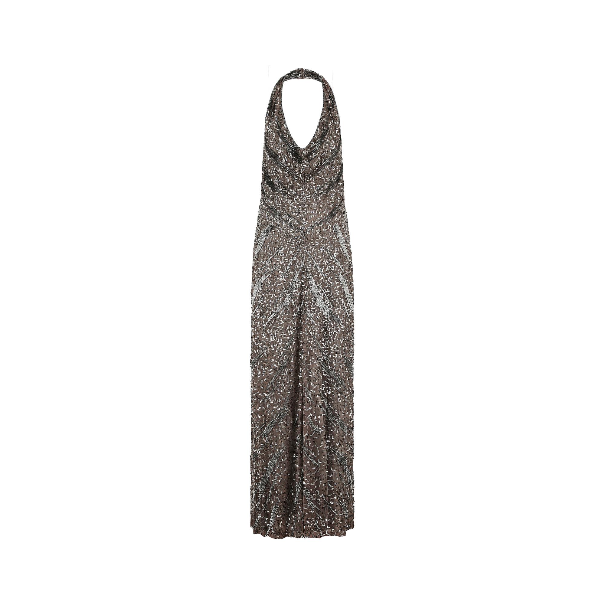 You're sure to turn eyes wearing this Max Mara evening gown, circa 2006-2007, just in time for the holiday and awards season. This showstopper of a dress reflects the 2000s Max Mara aesthetic and perfectly encapsulates the 'quiet luxury' trend for