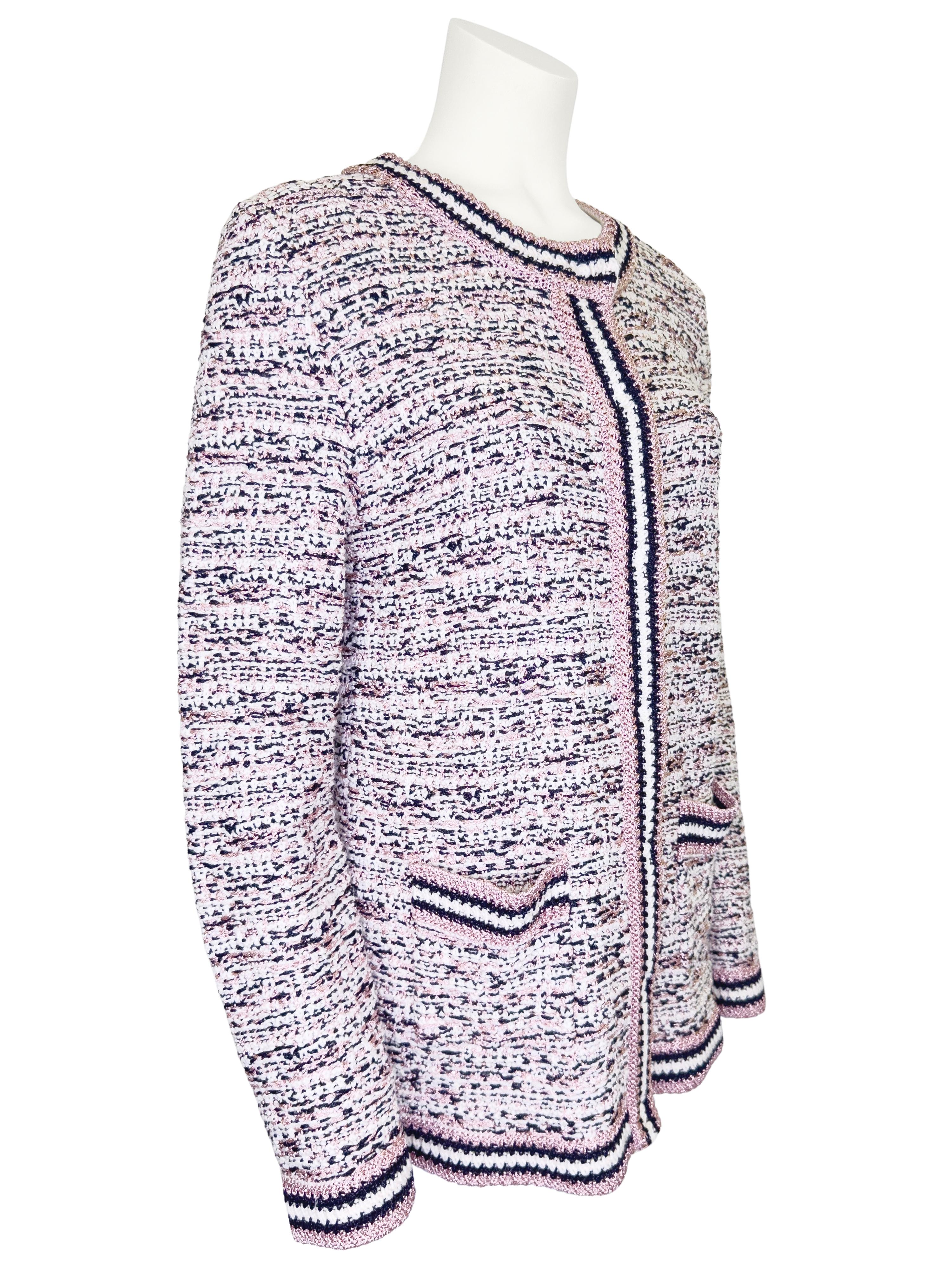 Missoni long cardigan from the mid 2000s. The midweight knit is comprised of black, white and a rose gold wool blended fiber. Snap closure down the front and finished along the edges, cuffs and top of the front patch pockets with a knit band of the