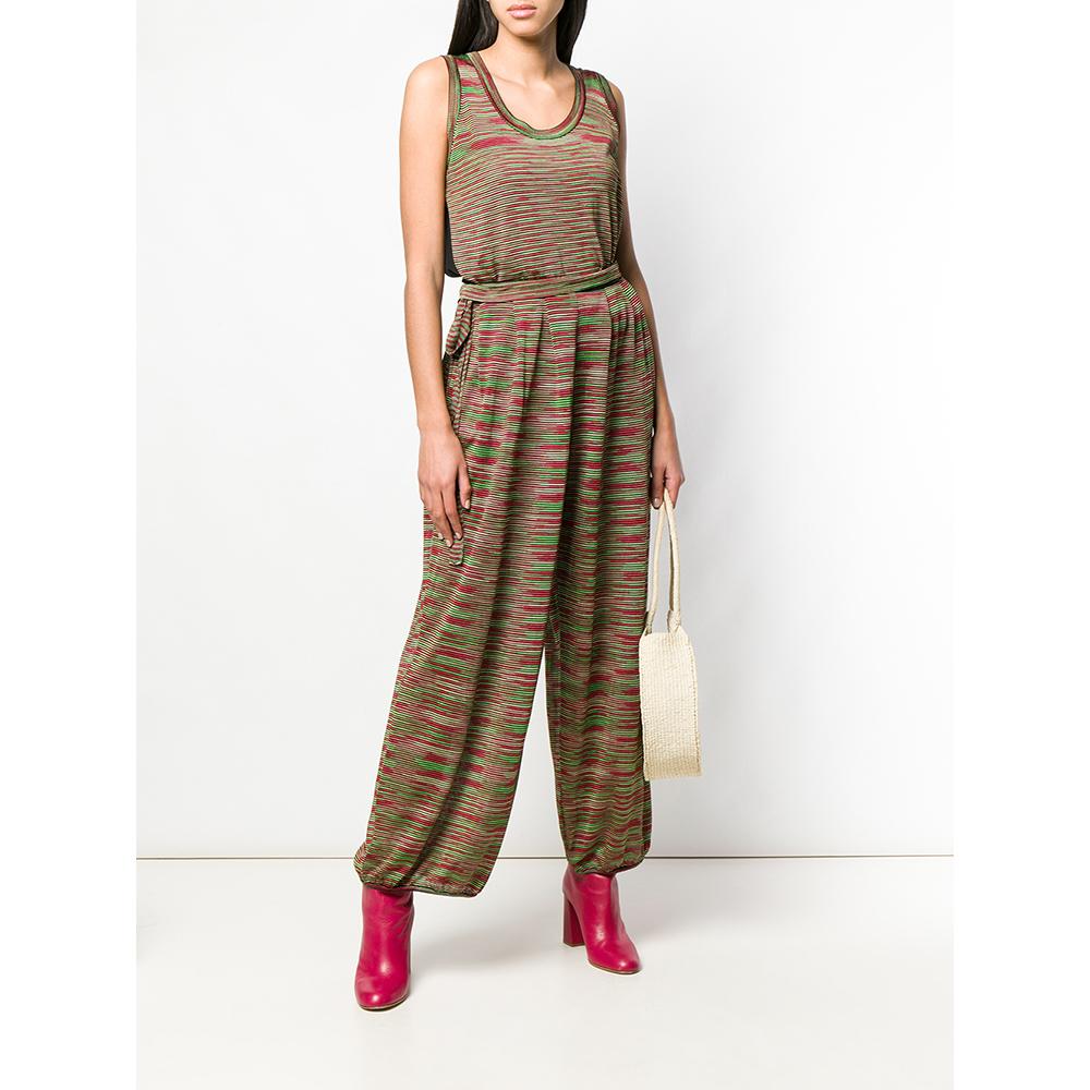 Missoni cotton blend fabric suit with horizontal stripes in shades of black, red, green and pastel yellow. Round neckline top, sleeveless, and wide trousers with elastic on the bottom and belt.
Years: 2000s

Made in China

Size: 42 IT

Linear