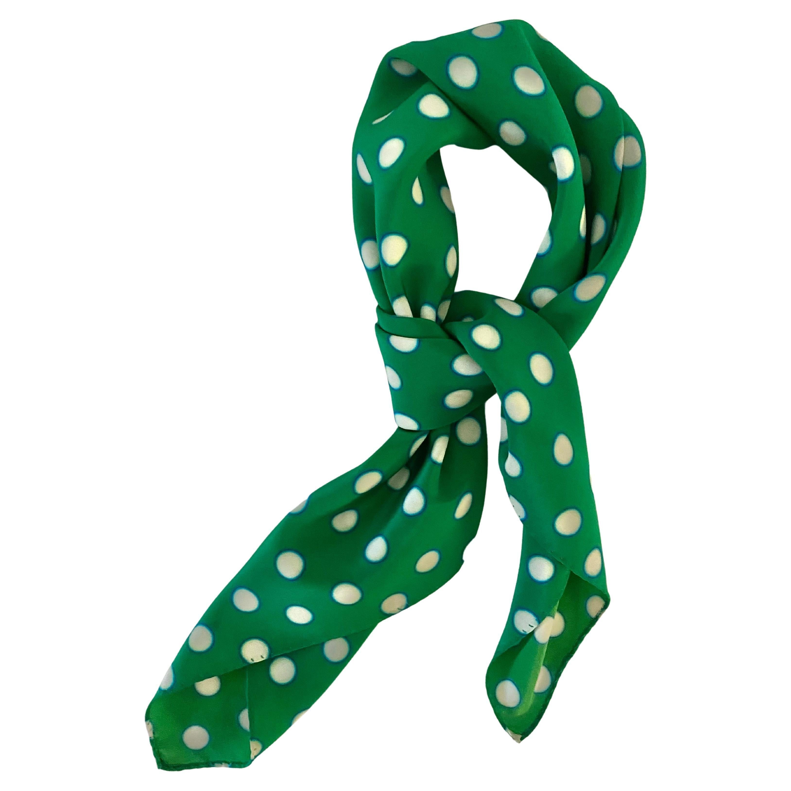 Experience Miu Miu's luxe with this green polka dot silk scarf. Adorn with finesse and style. Let this be your statement accessory speak for itself, Made in Italy 
Condition: vintage, 2000s, excellent 

Dimensions: 23x23in 