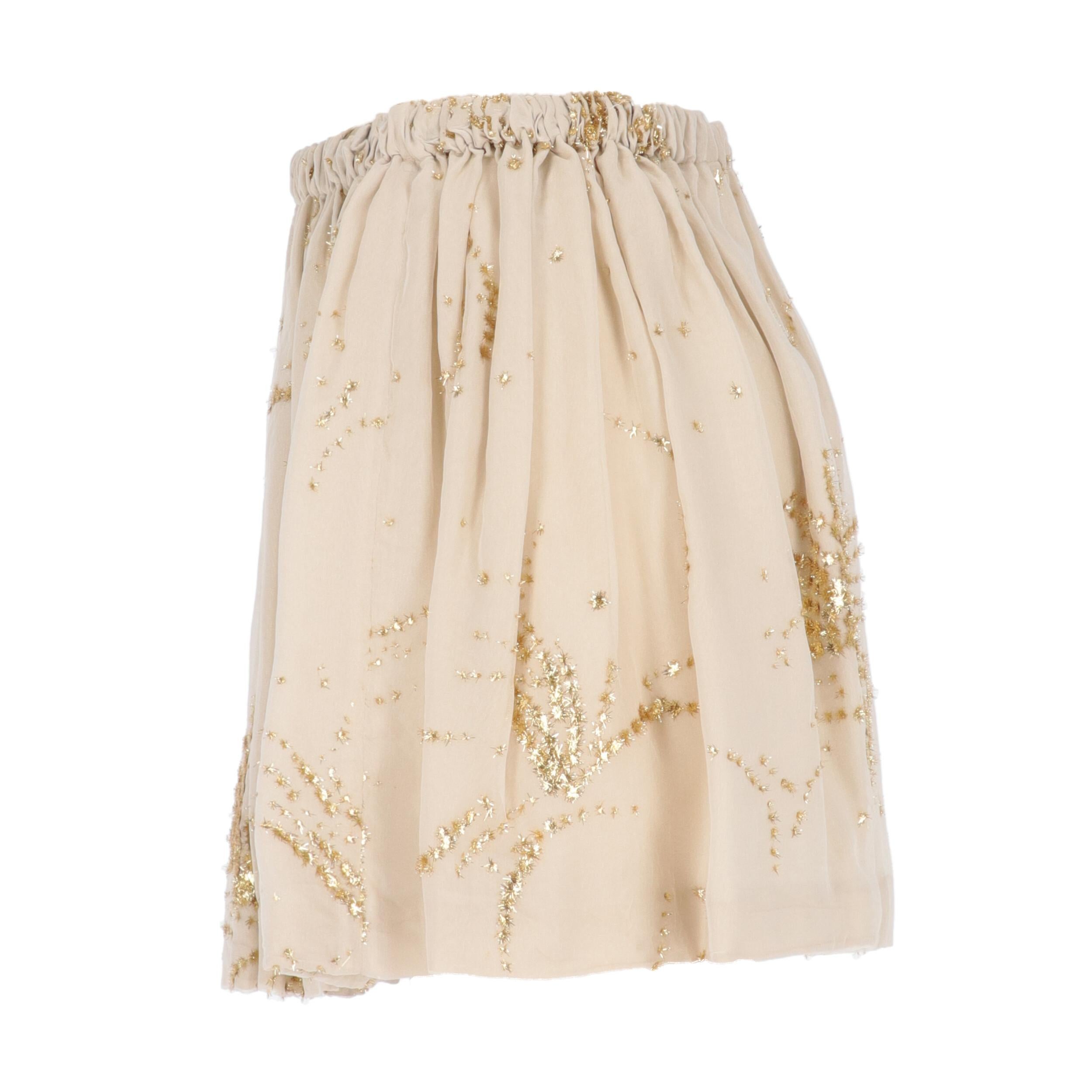 Miu Miu ivory polyester miniskirt with golden applications and elasticated waist.
Years: 2000s

Made in Italy

Size: 44 IT



Flat measurements

Height: 38 cm
Waist: 35 cm 