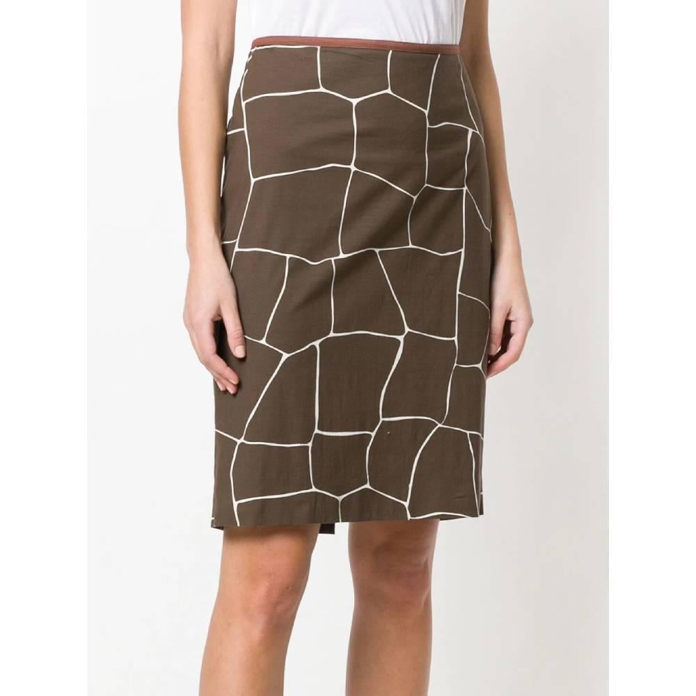 Miu Miu straight skirt with giraffe print in brown cotton blend, with high waist, zip and hook closure on the side, length above the knee, straight hem and rear slit on the hem.
Years: 2000

Made in Italy

Size: 46 IT

Linear measures

Lenght: 58