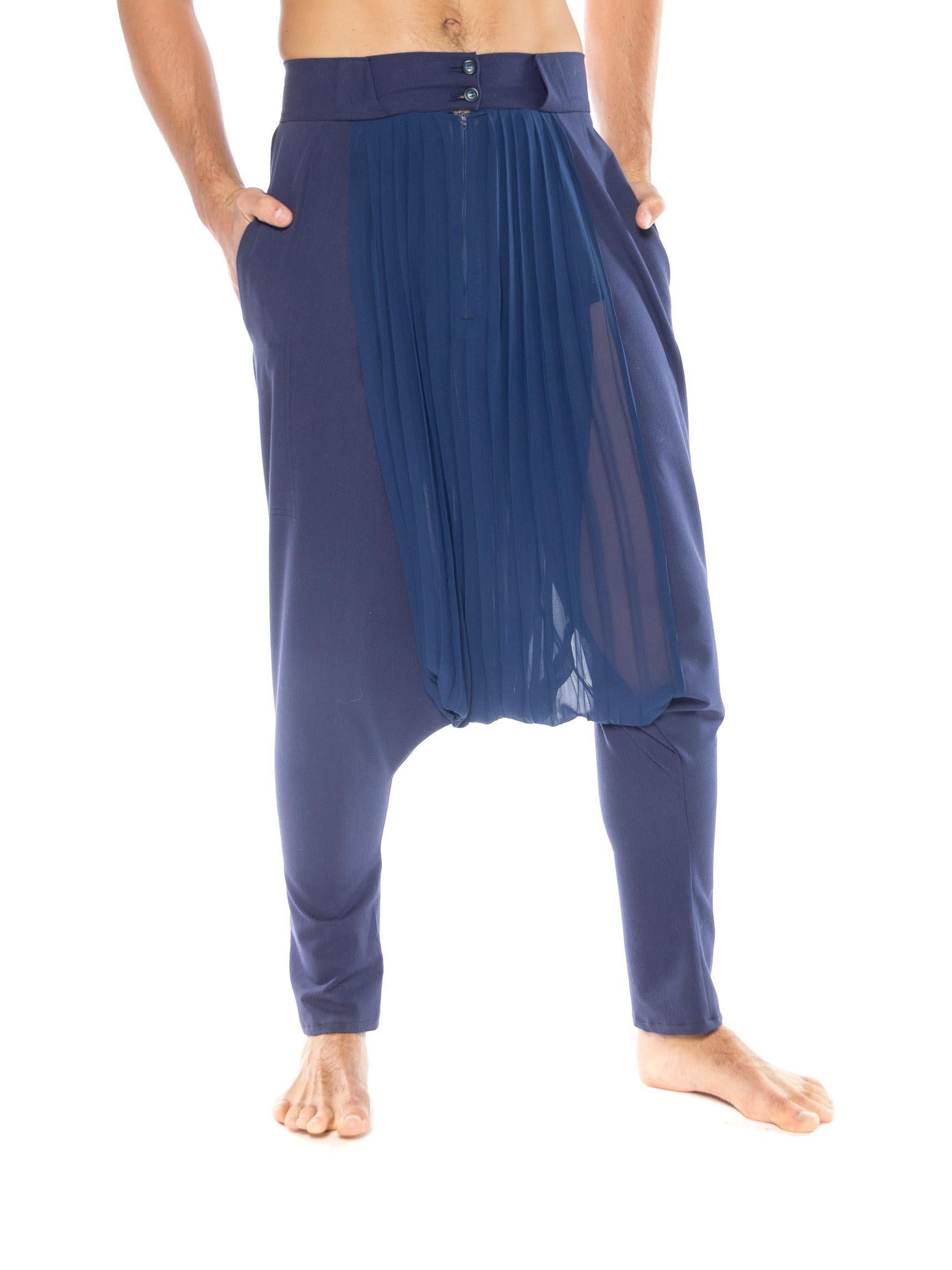 MORPHEW COLLECTION Blue  Pleated Polyester Chiffon & Wool Pants
MORPHEW COLLECTION is made entirely by hand in our NYC Ateliér of rare antique materials sourced from around the globe. Our sustainable vintage materials represent over a century of