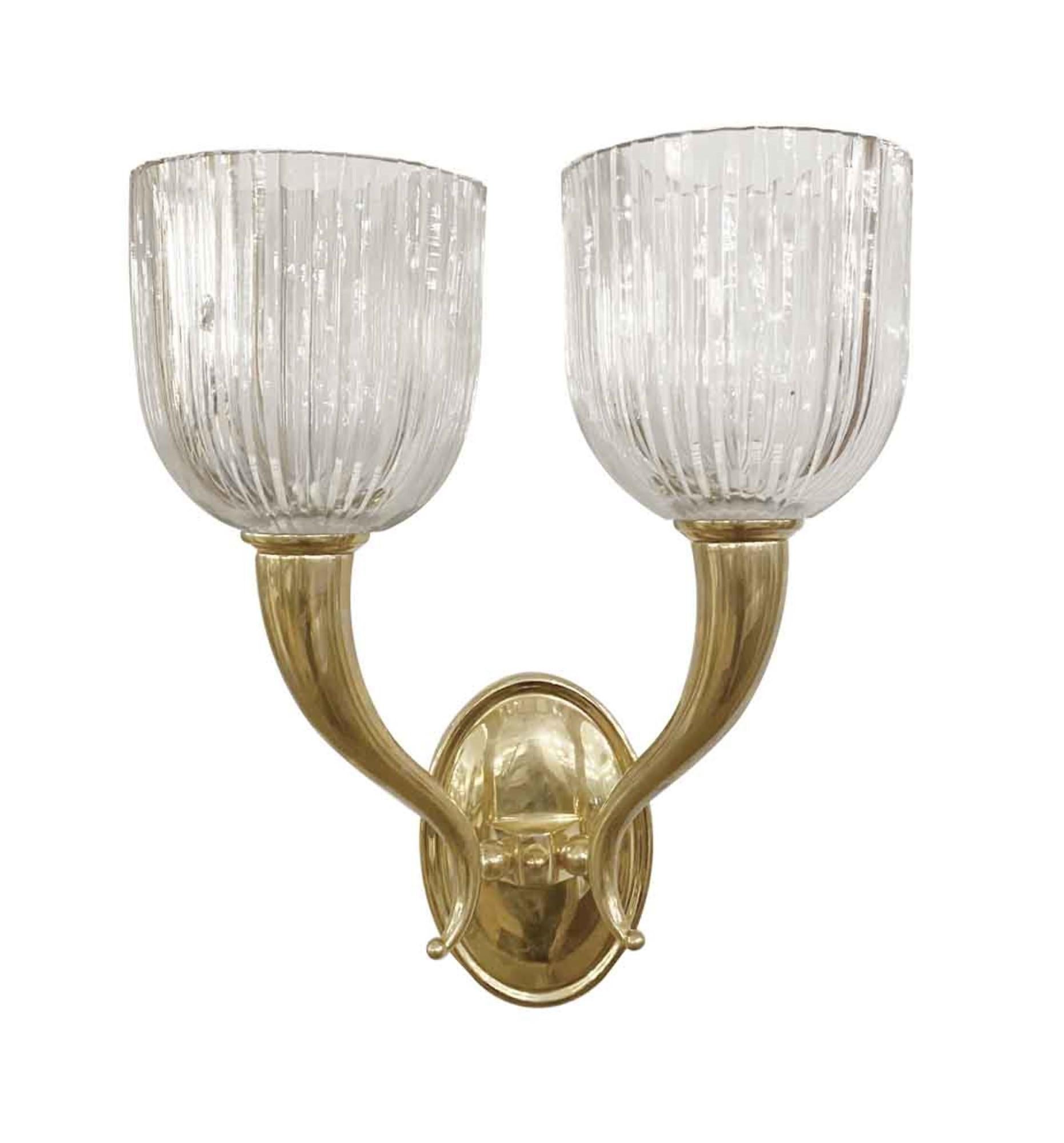 2000s brass sconces with heavy crystal fluted shades done in an Italian Modern style. Small quantity available at time of posting. Priced each pair. This can be seen at our 333 West 52nd St location in the Theater District West of Manhattan.