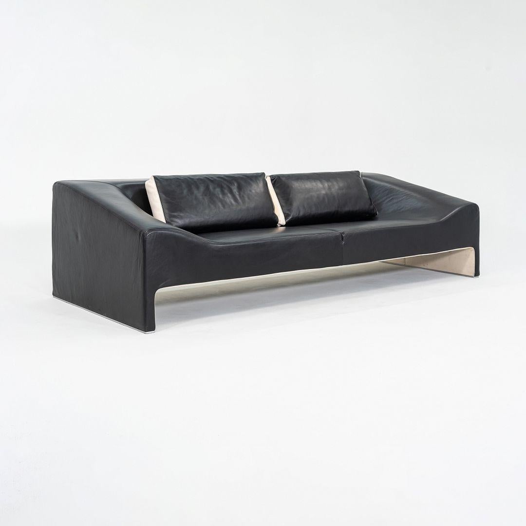 This is a Malmo Sofa designed by Patricia Urquiola for Moroso in 2002. This particular example was produced in Italy in the 2000s. The sofa features black leather upholstery over a distinctive, sculptural steel frame.
 
 The sofa measures