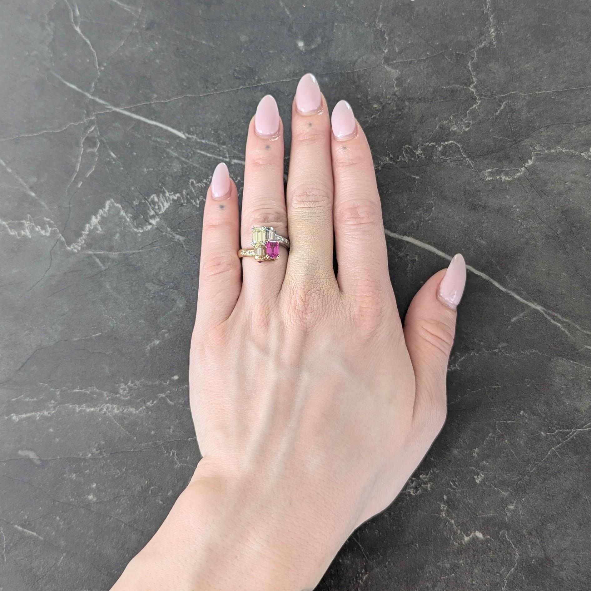 Designed as a bypass style shank terminating with juxtaposed emerald cut diamond and sapphire
Diamond weighs 1.00 carat - fancy light greenish yellow with VS2 clarity
Sapphire weighs 1.10 carat - transparent medium pink in color
Arranged