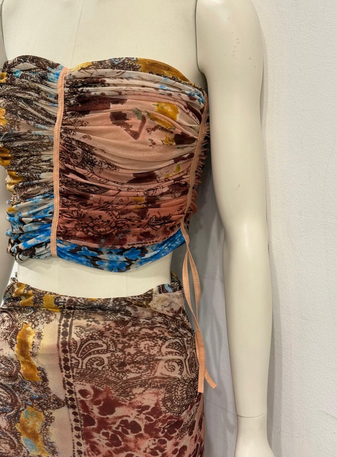 2000s Plein Sud mesh set top & skirt

This 2000s Plein Sud set features a printed mesh top and matching skirt in a signature body-hugging silhouette. Known for its sensual and deconstructed aesthetic, the brand captures the early-2000s spirit