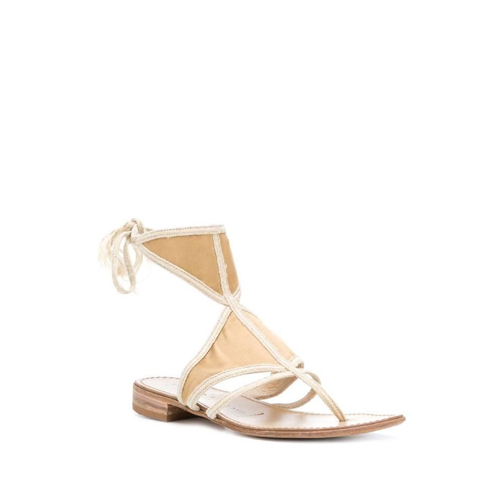 Prada beige flat sandals in rope, calfskin and satin. Thong model, ankle closure with wrap-around strap. Logoed leather insole. Flat sole.

Size: 37 ½ EU

Insole: 23.5 cm
Heel: 2 cm

Product code: A5312

Composition: 
Outer: Cotton - Satin
Lining: