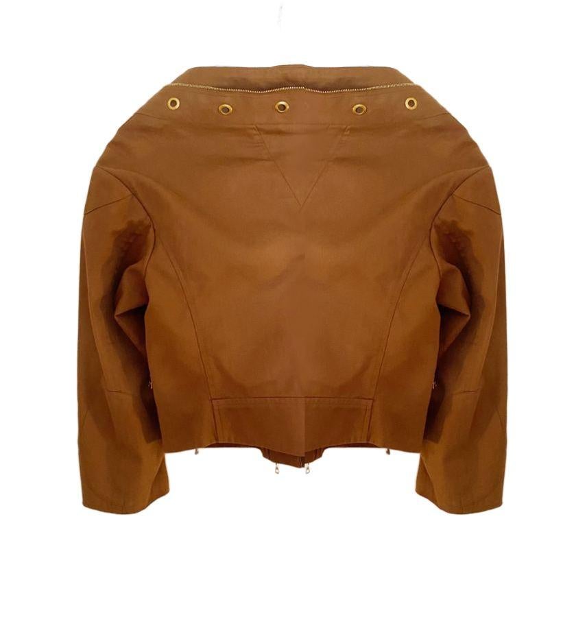 2000s Prada Brown Tobacco Cotton Cropped Jacket, gold hardware, front oblique zipped closure, short sleeves, V front Cut design, small zipped pocket, Made in Italy 

Size: 40 IT - 8UK - 0-2 USA 

Measurements (all measures are side to side)