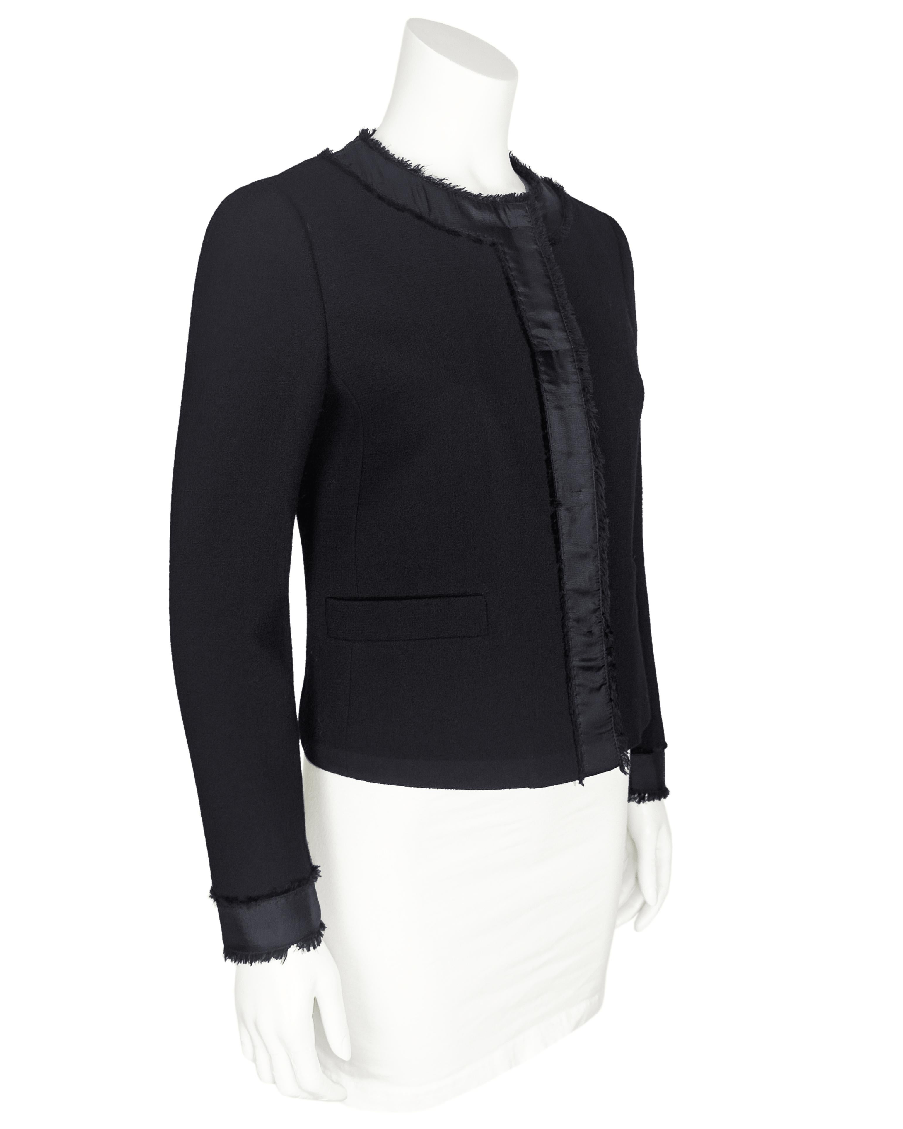Understated and very chic Prada evening jacket from the 2000's. Made from a silk and wool blend crepe with texturally contrasting delicate 1