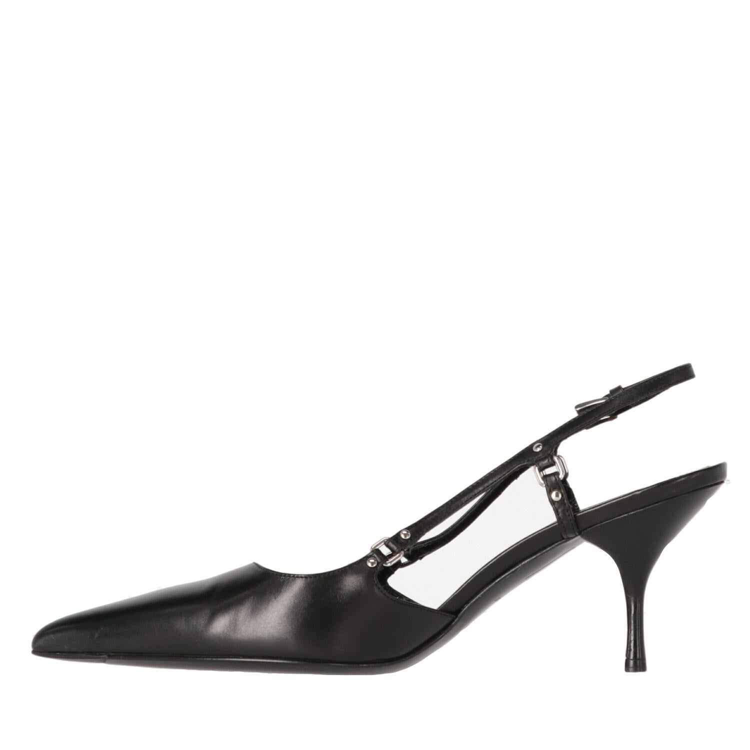 A.N.G.E.L.O. Vintage - ITALY
Prada black leather heeled slingback shoes with pointed toe. Model with little silver metal studs and ankle strap with silver metal buckle. Wooden kitten heels.

Item shows very light signs of wear on the leather, as