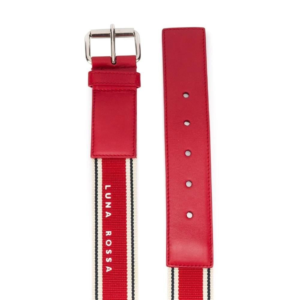 2000s Prada Luna Rossa red and white leather and fabric belt. Silver-tone metal buckle.

Size: 100 cm

Measurements
Length: 108 cm
Height: 3.5 cm

Product code: A6398

Composition: Cotton - Silk - Leather

Made in: Italy

Condition: Shows small flaws