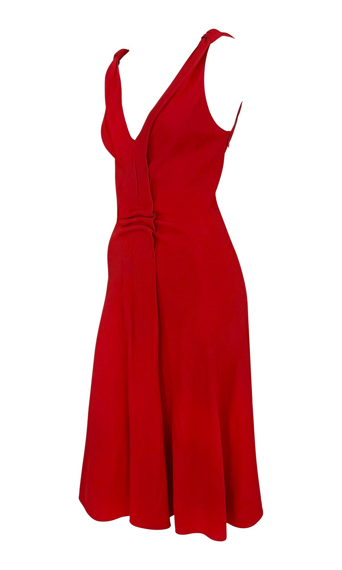 This sleeveless red dress from Prada’s 2000s collections features a fitted bodice with a V-neckline and a flared skirt. A gathered panel at the waist adds subtle structure and movement.

Approximate measurements:
Size - IT40
Bust: 34