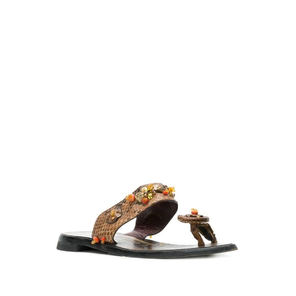Prada intra-toe sandals in brown snakeskin embellished with colored stones and beads.

The product shows slight signs of wear, as in pictures.

Please note, this item cannot be shipped outside the European Union.

Years: 2000s

Made in Italy

Size: