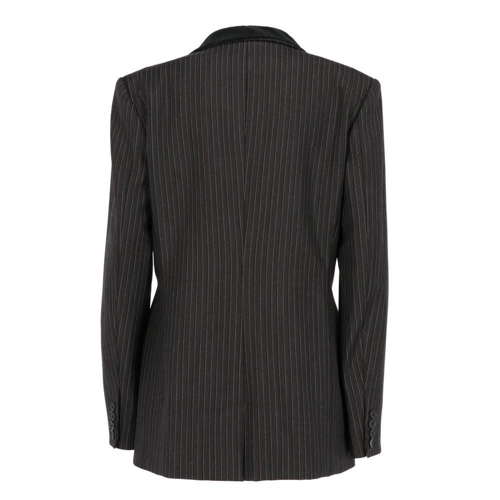 Ralph by Ralph Lauren pinstriped blazer. Classic velvet lapel collar, frontal conceared closure, three welt pockets, two of them with flaps. Long sleeves with buttoned cuffs.

Size: 12 US

Flat measurements
Height: 73 cm
Bust: 48 cm
Shoulders: 49