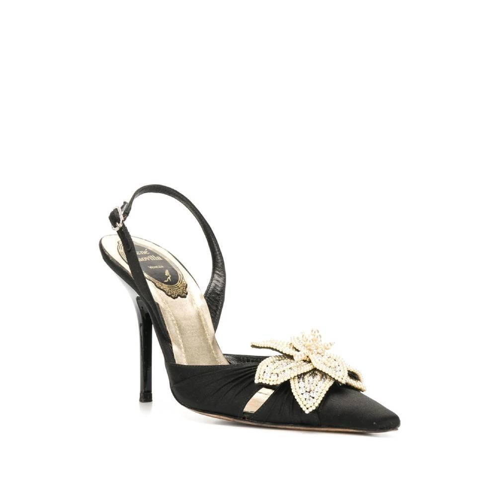 René Caovilla black silk satin pointed pumps with ivory and silver beaded decorative flower. Adjustable ankle strap with decorated buckle and stiletto heel.

Size: 35 EU

Heels: 10.5 cm
Sole length: 23,5 cm

Product code: A5094

Composition: 
Outer: