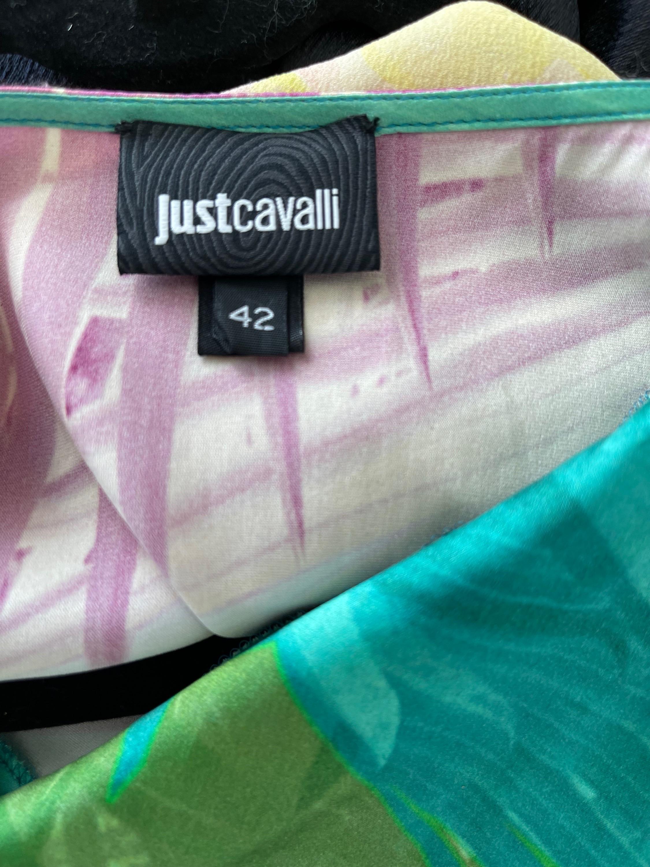 Beautiful JUST CAVALLI colorful tropical print sleeveless silk dress ! Features palm prints in vibrant colors of pink, fuchsia, purple, turquoise blue, peach and green throughout. Lots of flattering drape effects. White patent leather belt is
