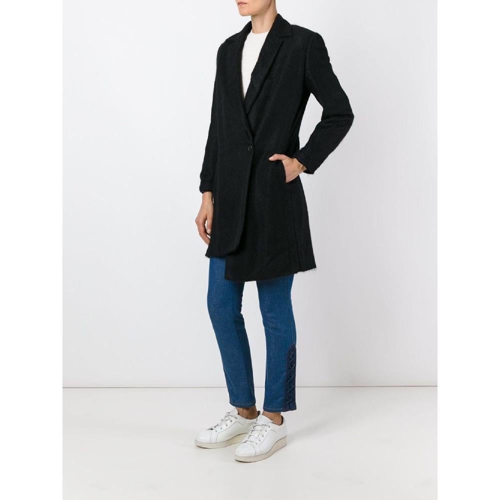 Romeo Gigli black wool blend coat. Classic lapel collar, asymmetrical closure with single off-center front buttoning and side pockets.

Years: 2000s  
Made in Italy

Size: 48 IT  
Flat measurements 
Height: 96,5 cm 
Bust: 58 cm 
Shoulders: 44 cm