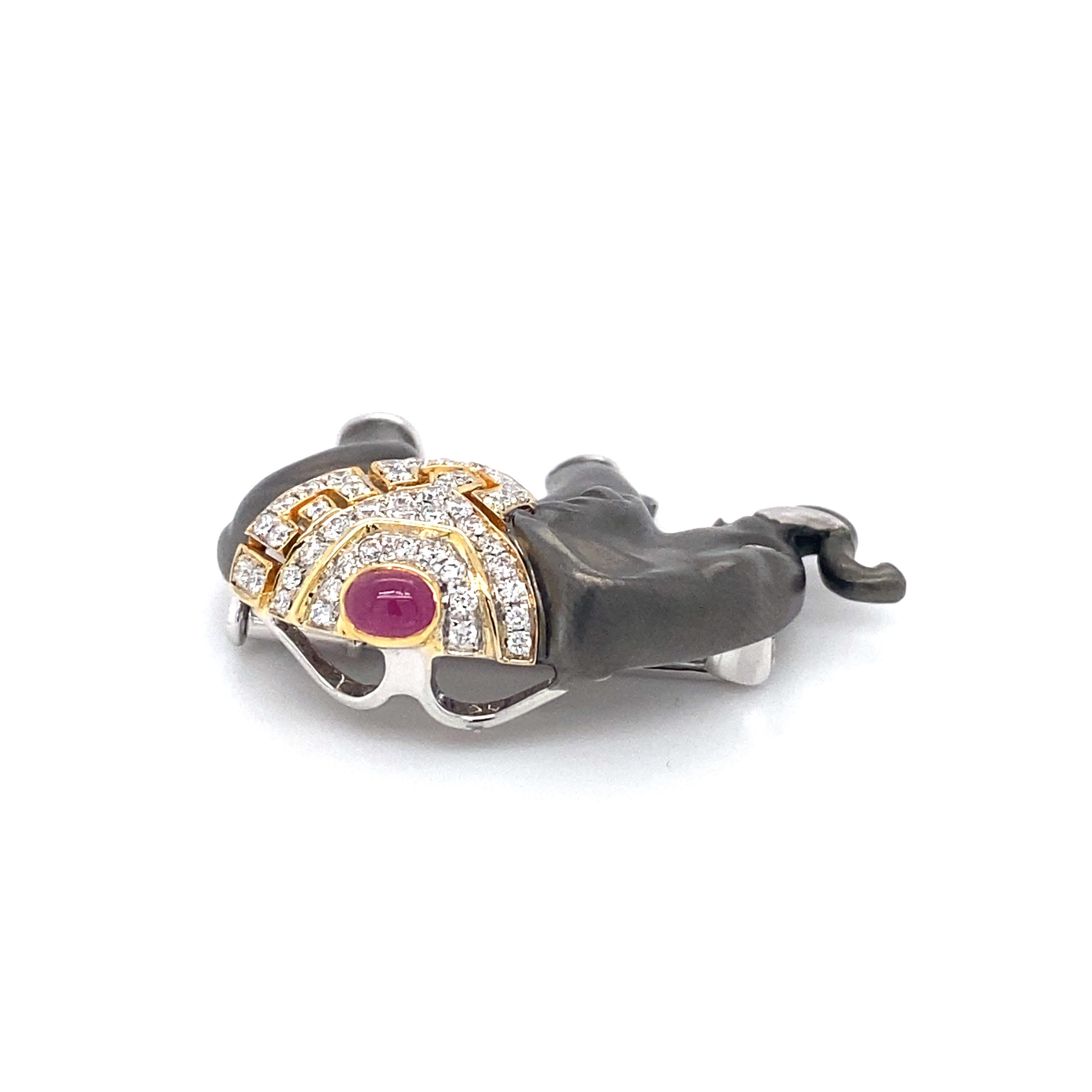 Item Details: This elegant and unique elephant brooch features a cabochon ruby and a tiny diamond eye.

Circa: 2000s
Metal Type: 18 karat white gold
Weight: 10.8 grams

Diamond Details:

Carat: 0.40 carat total weight
Shape: Round and