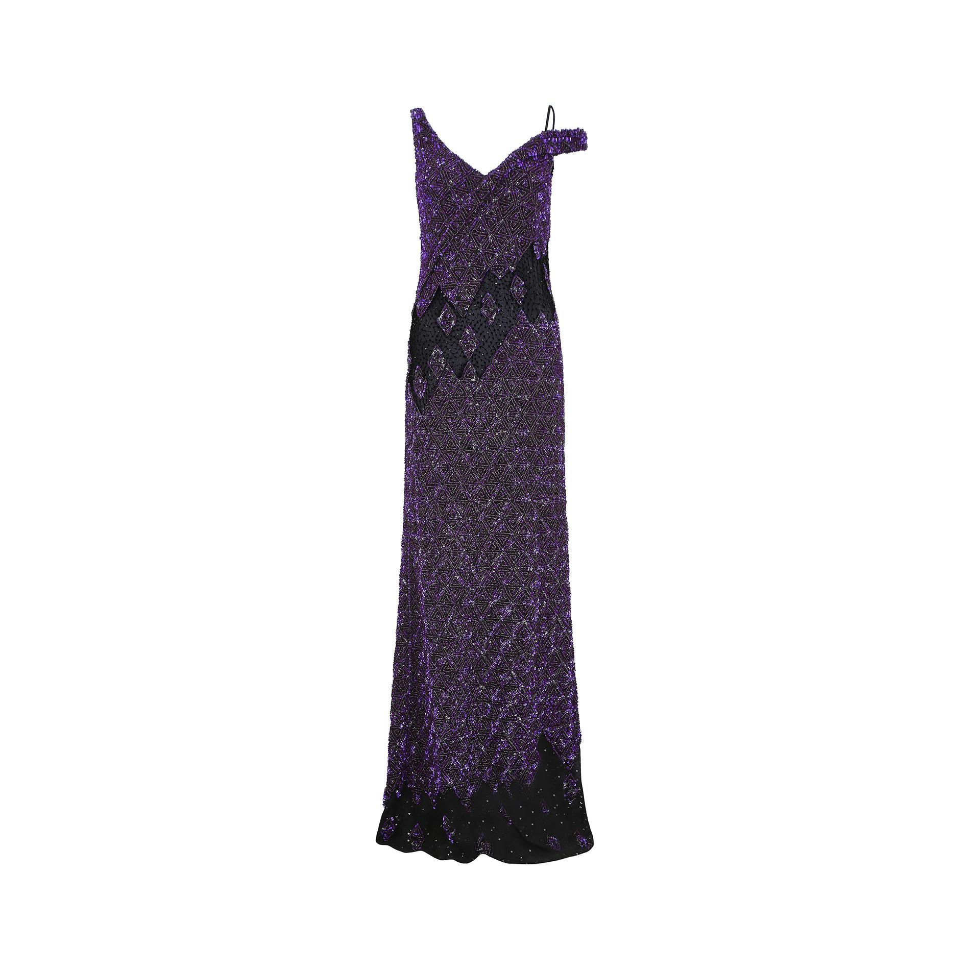 This is a magnificent purple sequin gown by Parisian Atelier Guy Laroche - the exact gown pictured from the Fall/Winter 2007 collection. It has a one shoulder finish, with a V neckline to both front and back, complete with original zip closure and