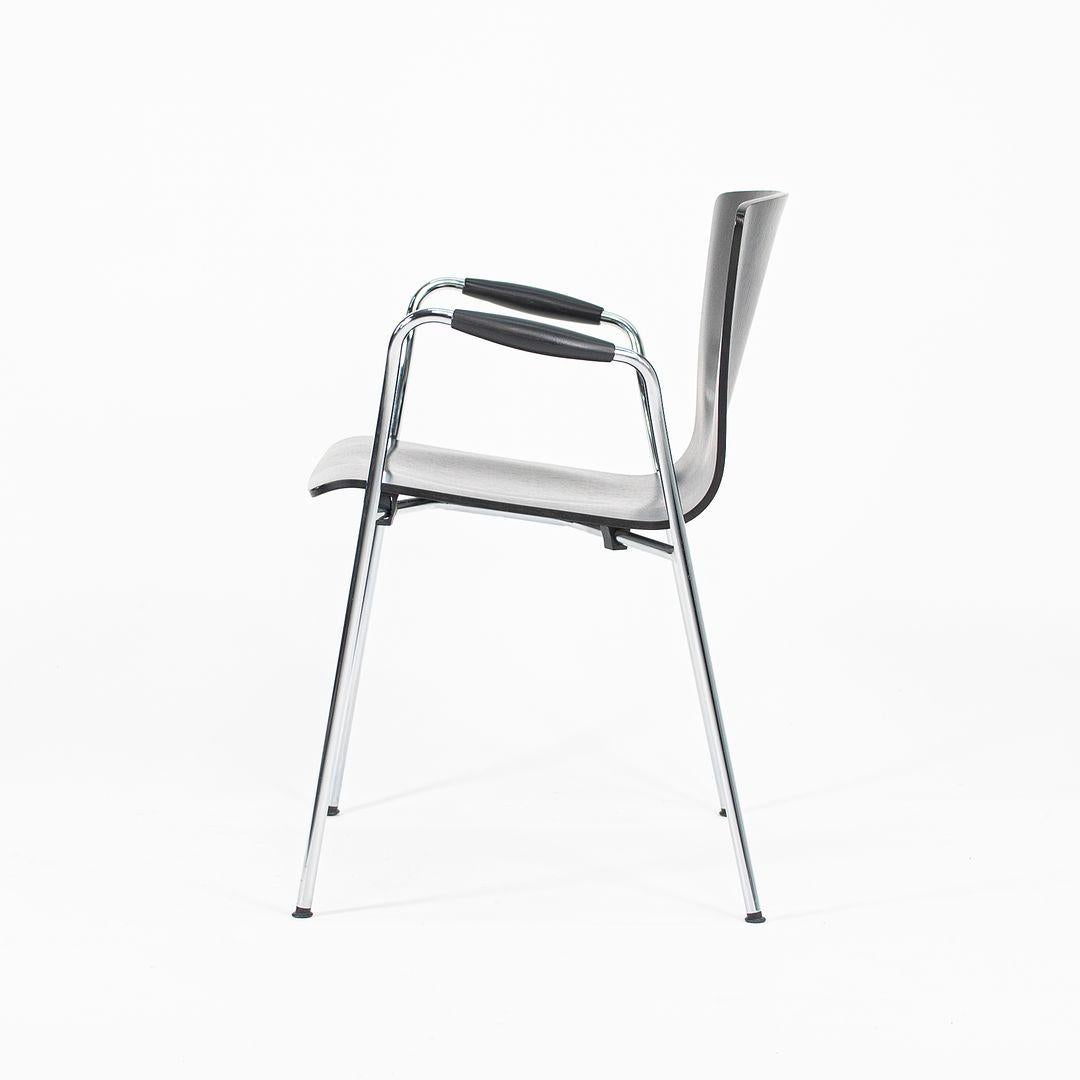 These are a set of three Cirene stackable Ebonized chairs, originally designed by Vico Magistretti in 1999. These particular examples were produced by DePadova for Knoll in Italy. The design of this silhouette is composed of a tubular steel frame