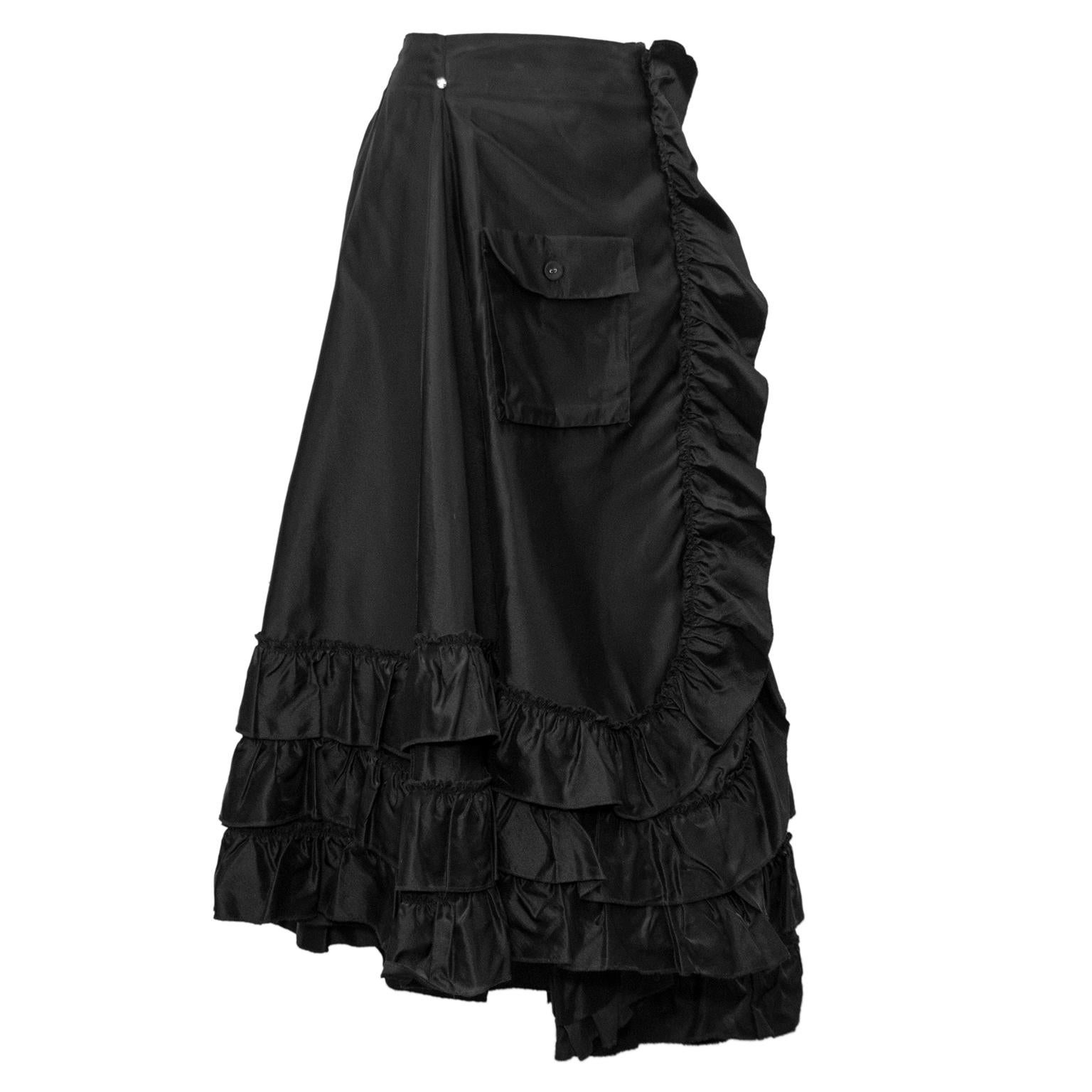 Fabulous Sonia Rykiel skirt from the 2000s. This piece is over the top, in the most perfect way. High waisted, wrap style with a diagonal cargo pocket and a large ruffled hem. A small accent rhinestone sits at the right hip when wearing. A-line