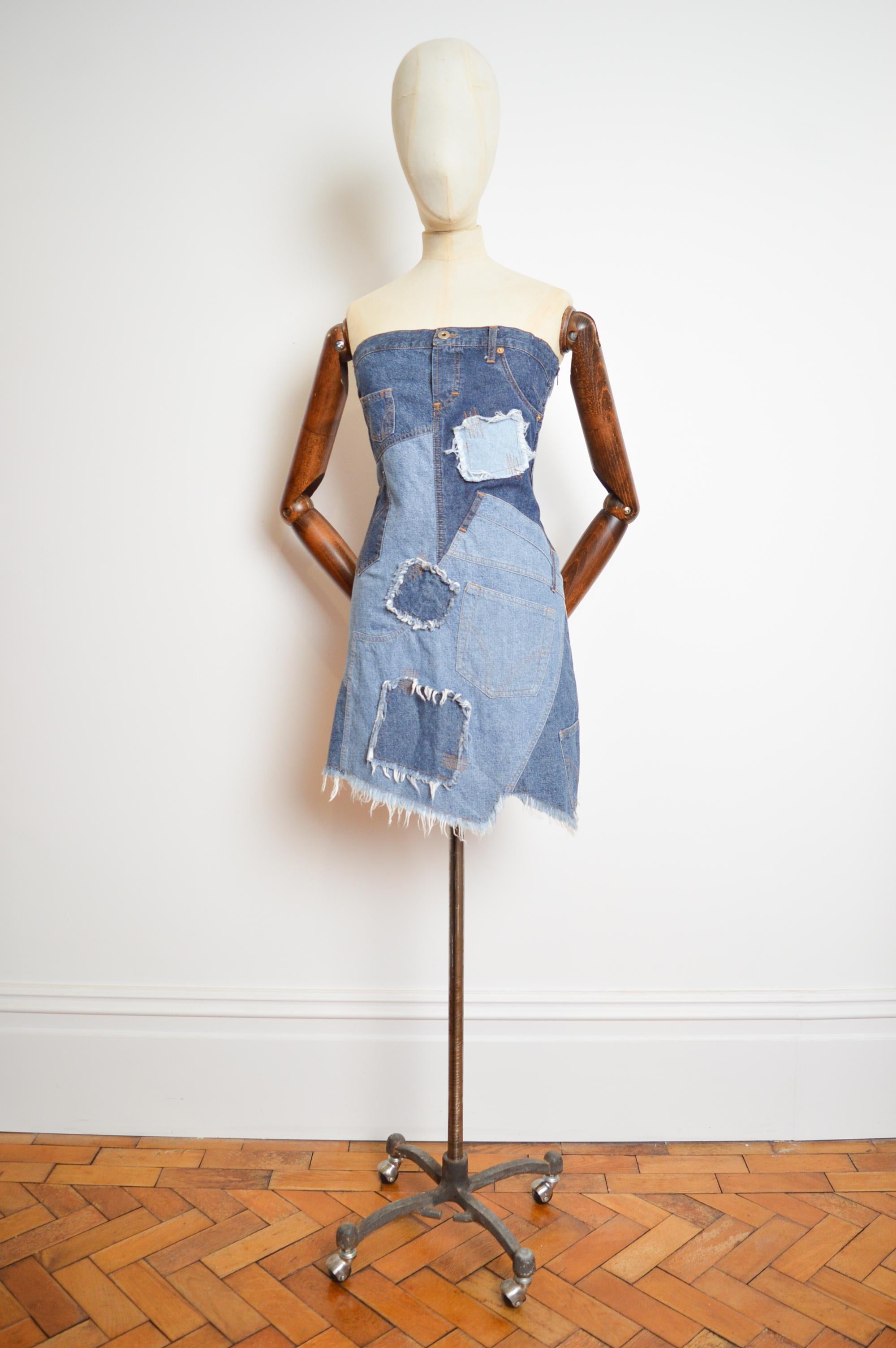 Fabulous 2000's Vintage Dolce & Gabbana fitted bustier cocktail dress crafted from patchwork denim, with a concealed side zip and jagged above the knee length hem.

MADE IN ITALY !

Measurements given in inches ; 
Pit to Pit; 18”
Nape to Hem; Approx