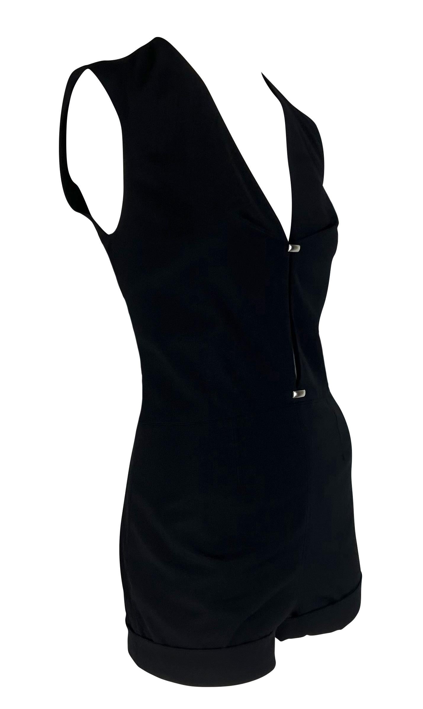 Presenting a black Thierry Mugler short romper, designed by Manfred Mugler. From the early 2000s, this short jumpsuit features short sleeves and a deep v-neckline. Silver-tone metal accents are scattered throughout the piece and connect eyelet