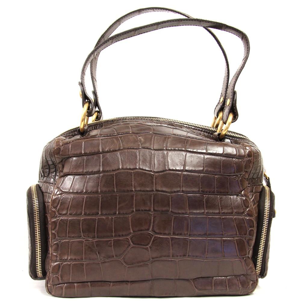 Tod’s brown crocodile leather handbag. Double handle, zipped fastening and five external zipped patch pockets. One zipped internal pocket.

Height: 20 cm
Width: 25 cm
Depth: 12 cm

Product code: X5129

Notes: Please note that this item cannot be