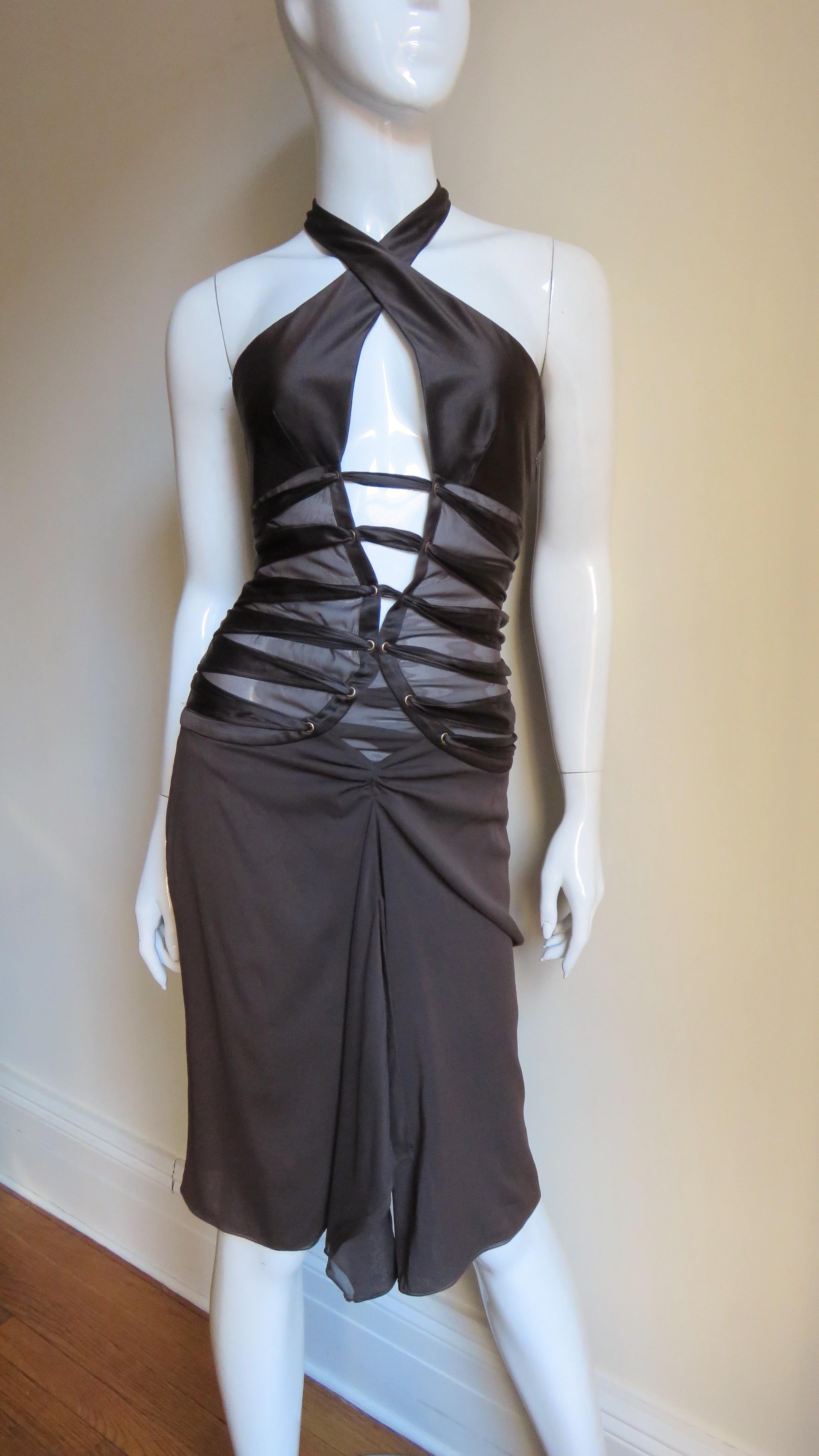 This is a gorgeous rich chocolate brown silk halter dress by Tom Ford for Gucci.  It has a deep plunging front crossing halter neckline sheer on the sides below the bust, bare at the back to below the waist except for rows of horizontal straps