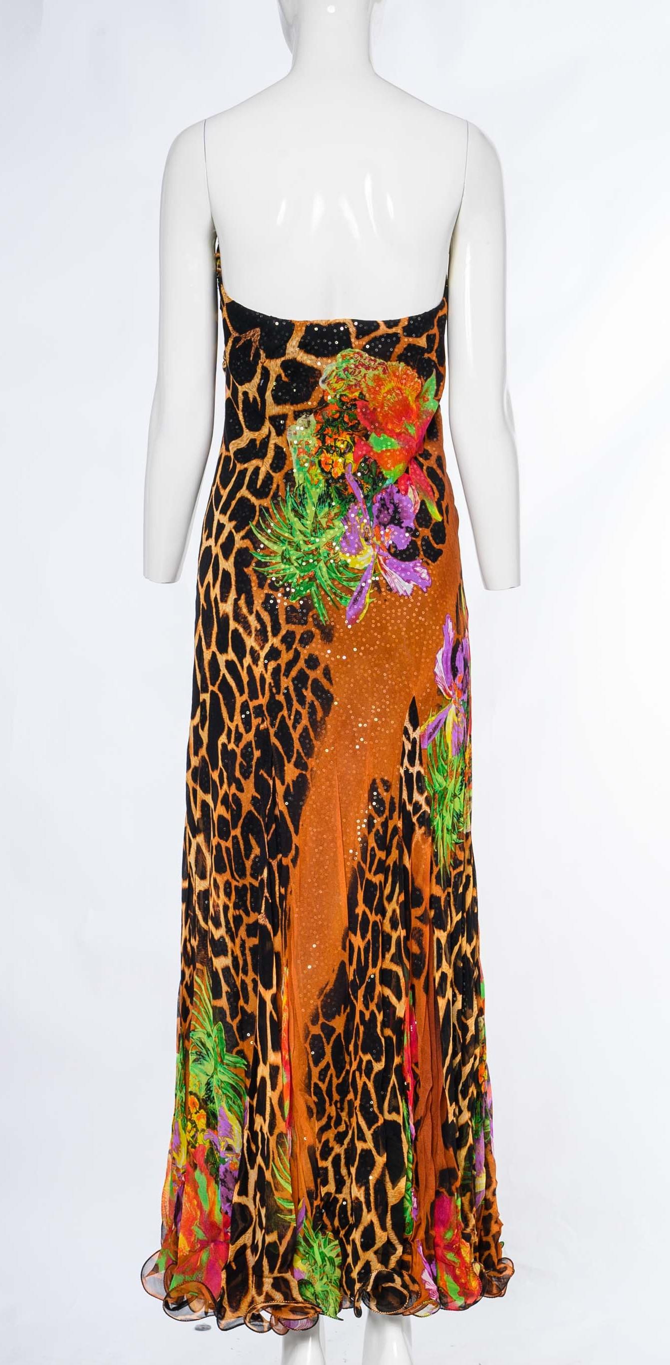 The vintage Diane Freis sequin evening dress is an exquisite and glamorous piece that is guaranteed to leave a lasting impression. With its bold leopard print and tropical floral motif, this dress exudes an air of captivating allure and exotic