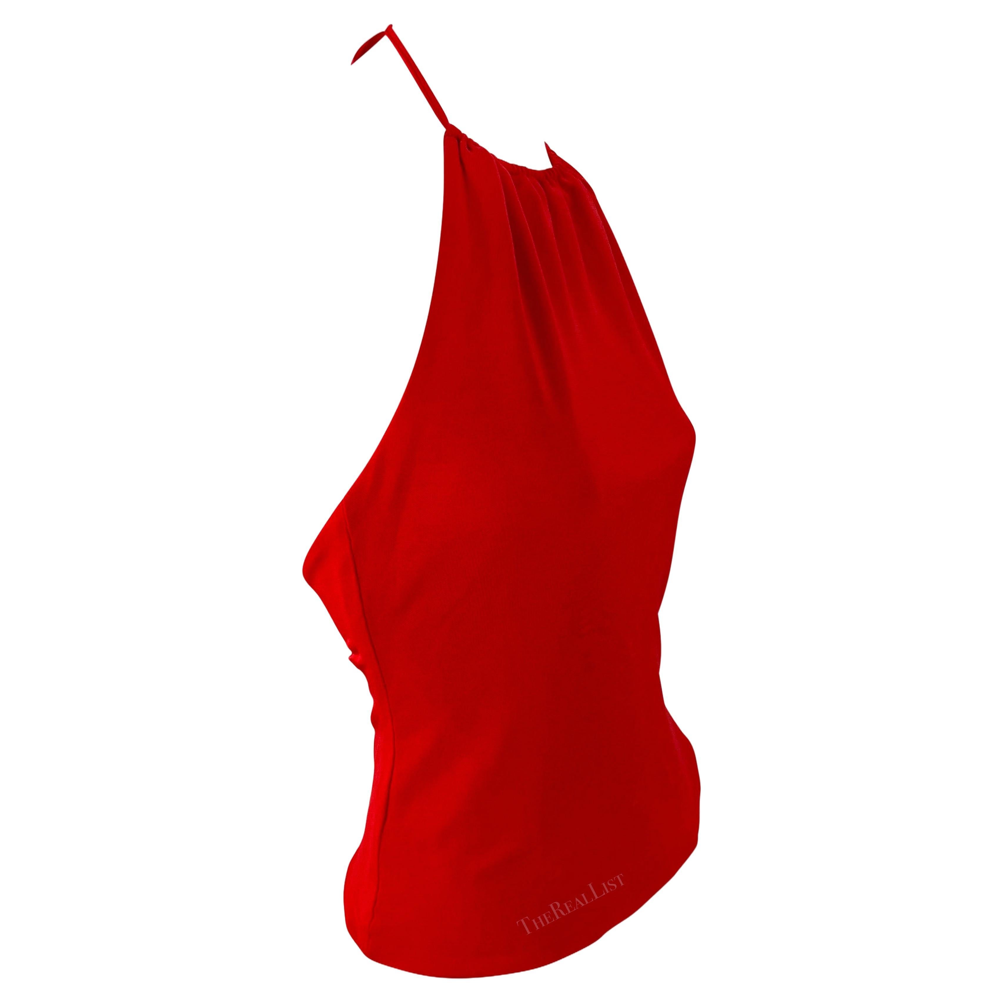 Presenting a fabulous cherry red halterneck top by Yigal Azrouël from the early 2000s. This bright red top boasts a halterneck tie and a partially exposed back.

Approximate measurements:
Size - 4US
Shoulder to hem: 15