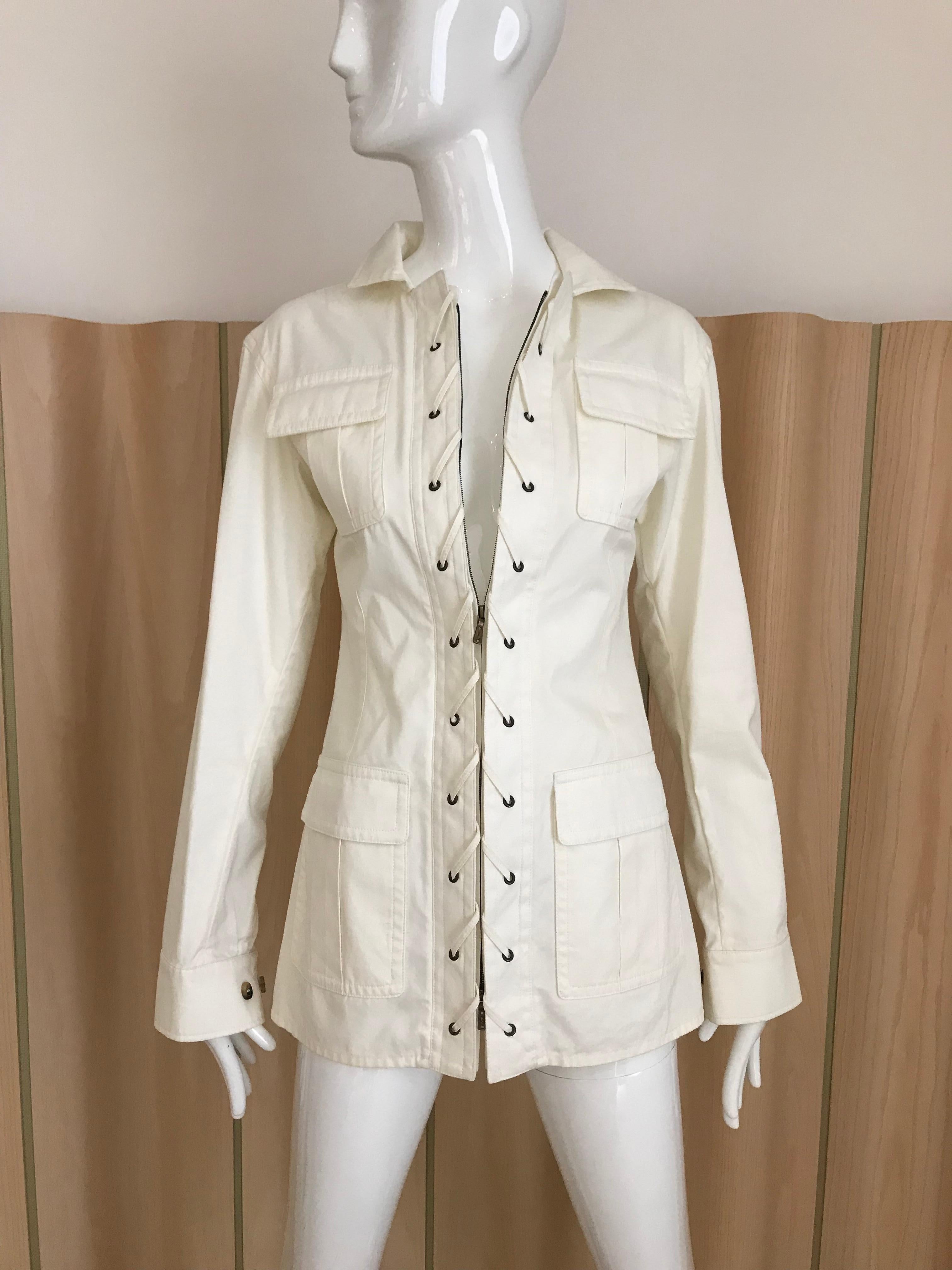 Yves Saint Laurent white cotton long sleeve safari style Jacket with zipper unworn with store tag.
Fit size 4. Jacket marked F36