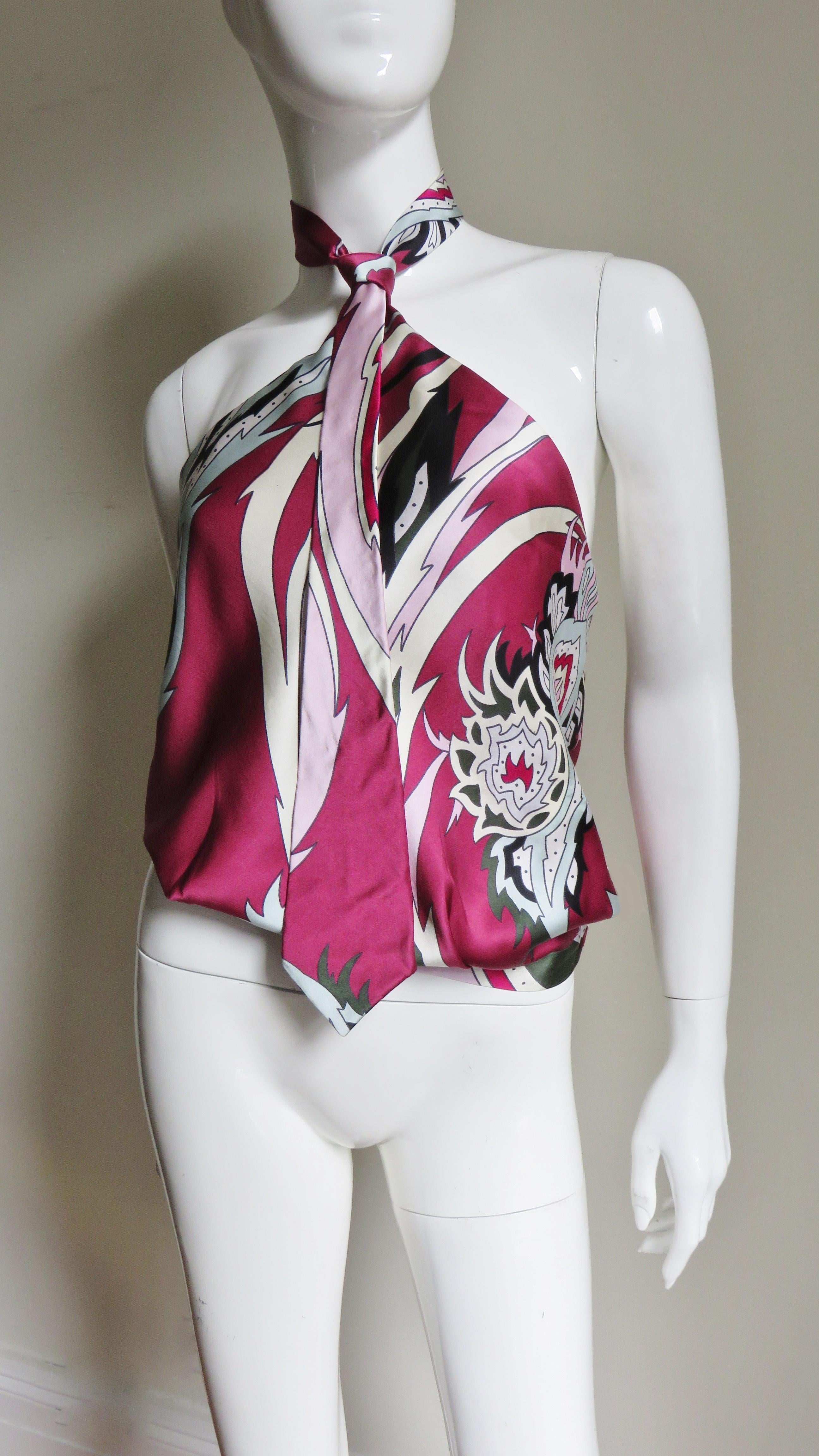 A gorgeous silk halter top from Alexander McQueen's Spring/Summer 2001 collection in a deep rose, white, pink and black abstract pattern.  It has a functional, adjustable necktie stylized halter strap around the neck, a blouson body and a horizontal