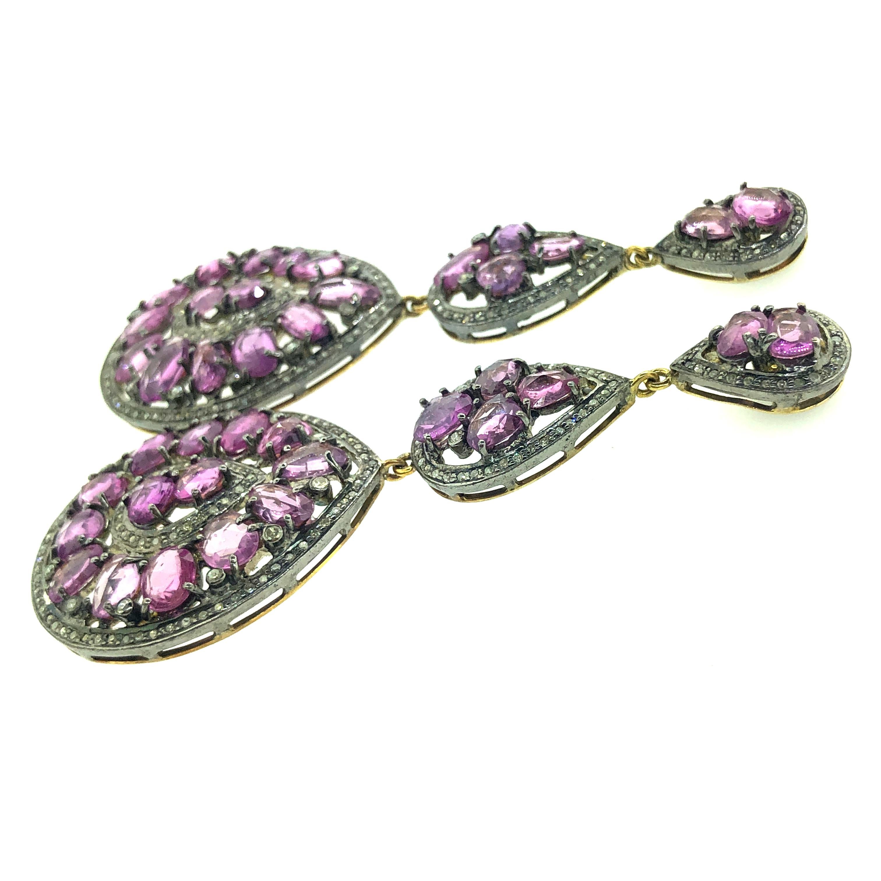 20.01 ct Pink Sapphire and 1.53 ct Champagne Diamond Earring set in Oxidized Sterling Silver with pure 14K Gold post and jump rings. The earring is 3 Inch Long with three tear drop shapesjoint with each other by 14K Gold Jumprings. All the stones