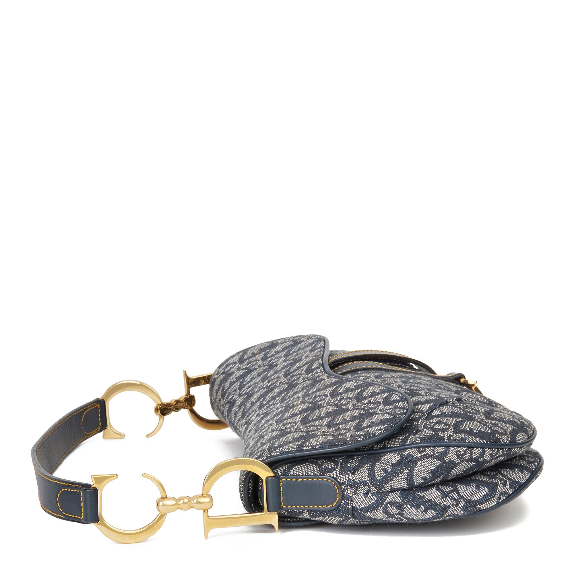 CHRISTIAN DIOR
Blue Monogram Canvas Saddle Bag

Xupes Reference: HB2992
Serial Number: RU0011
Age (Circa): 2001
Authenticity Details: Date Stamp (Made in Italy)
Gender: Ladies
Type: Top Handle, Shoulder

Colour: Blue
Hardware: Gold
Material(s):