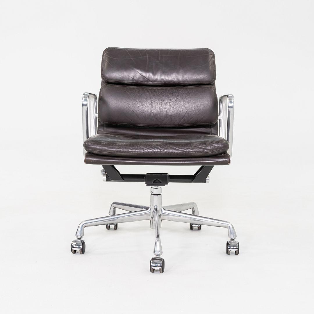 This is an Eames Aluminum Group Soft Pad Management Desk Chair, Model EA435, originally designed by Charles and Ray Eames for Herman Miller in 1969. These examples date to the year 2001. The design features a cast aluminum frame with adjustable