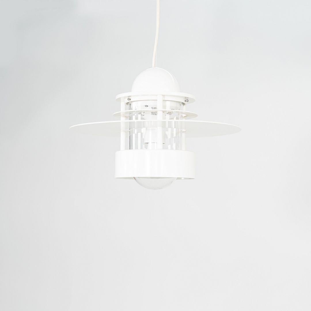 This is a Planet of Albertslund Pendant Light, originally designed by Jens Moller-Jensen in 1963. This particular example was produced by Louis Poulsen in Denmark C. 2001. The lamp features a saturn ring made of aluminum, anti glare rings of