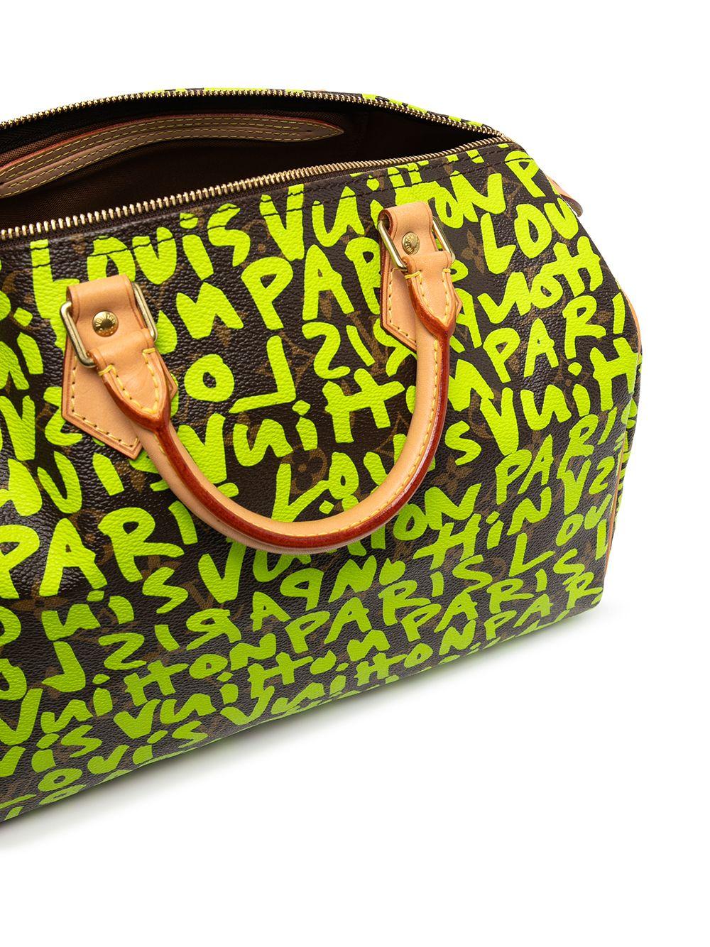 Add some excitement to your outfit with this pre-owned Louis Vuitton Speedy 30. Designed in 2001 by Marc Jacobs in collaboration with Stephen Sprouse this iconic speedy bag features a lime green graffiti design, shiny gold-tone hardware, top zip