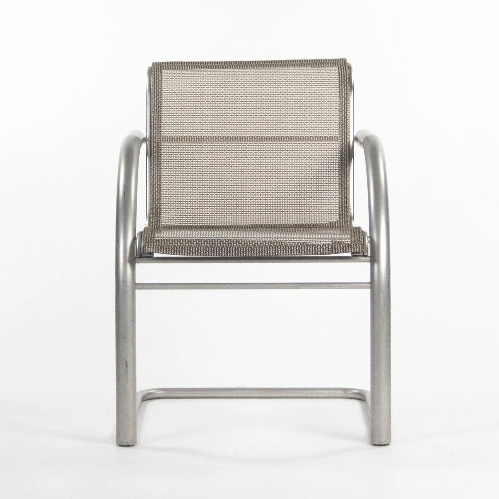 Listed for sale is a Richard Schultz 2002 Collection stainless steel cantilever dining chair prototype with mesh upholstery. This is a marvelous and rare example of a 2002 collection dining chair. The stainless steel frame is in terrific shape and