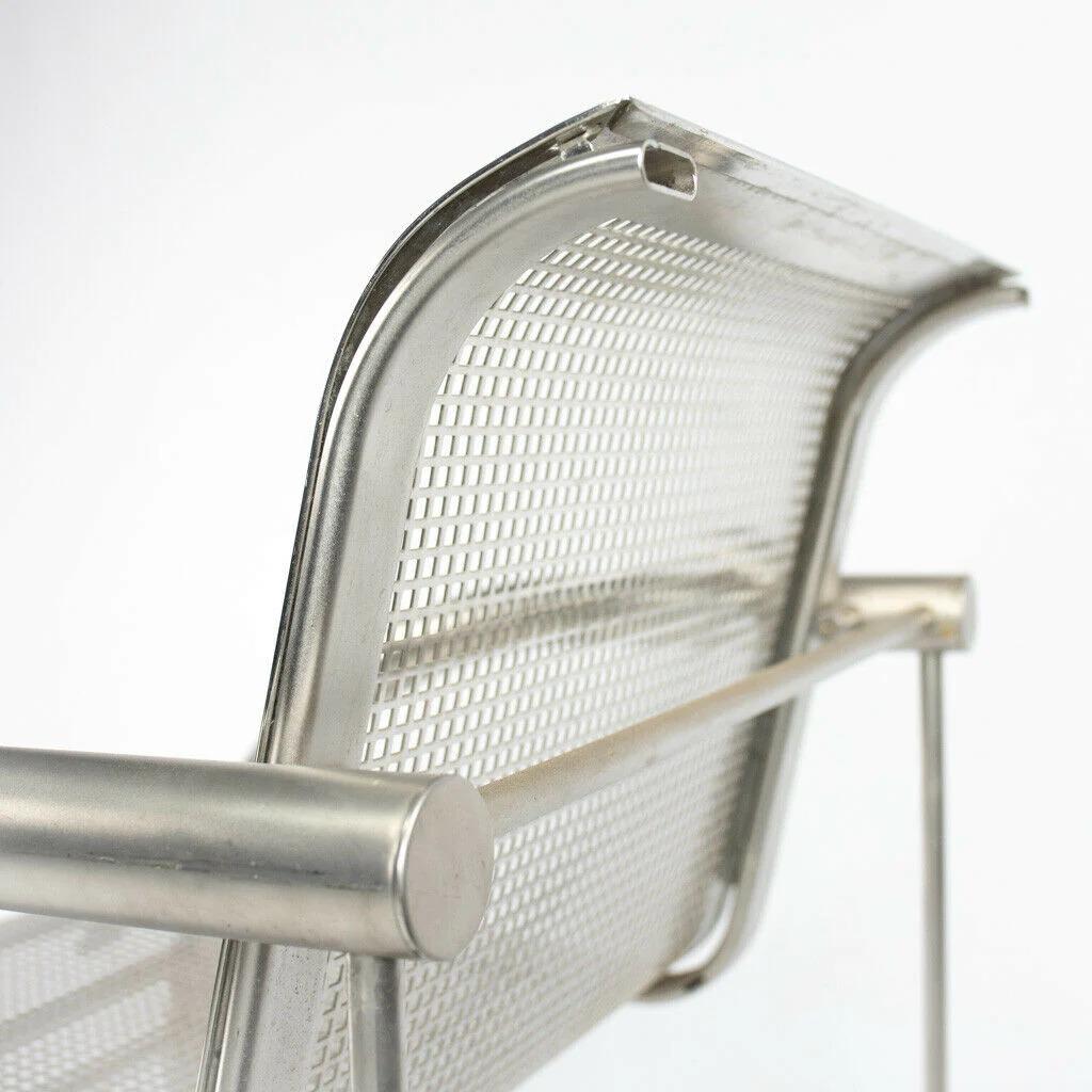 Listed for sale is a Richard Schultz 2002 Collection stainless steel dining chair prototype with custom polished perforated steel seat. The chair measures 31 inches tall by 23 inches wide and 24.5 inches deep. The arm height is 26 inches from the