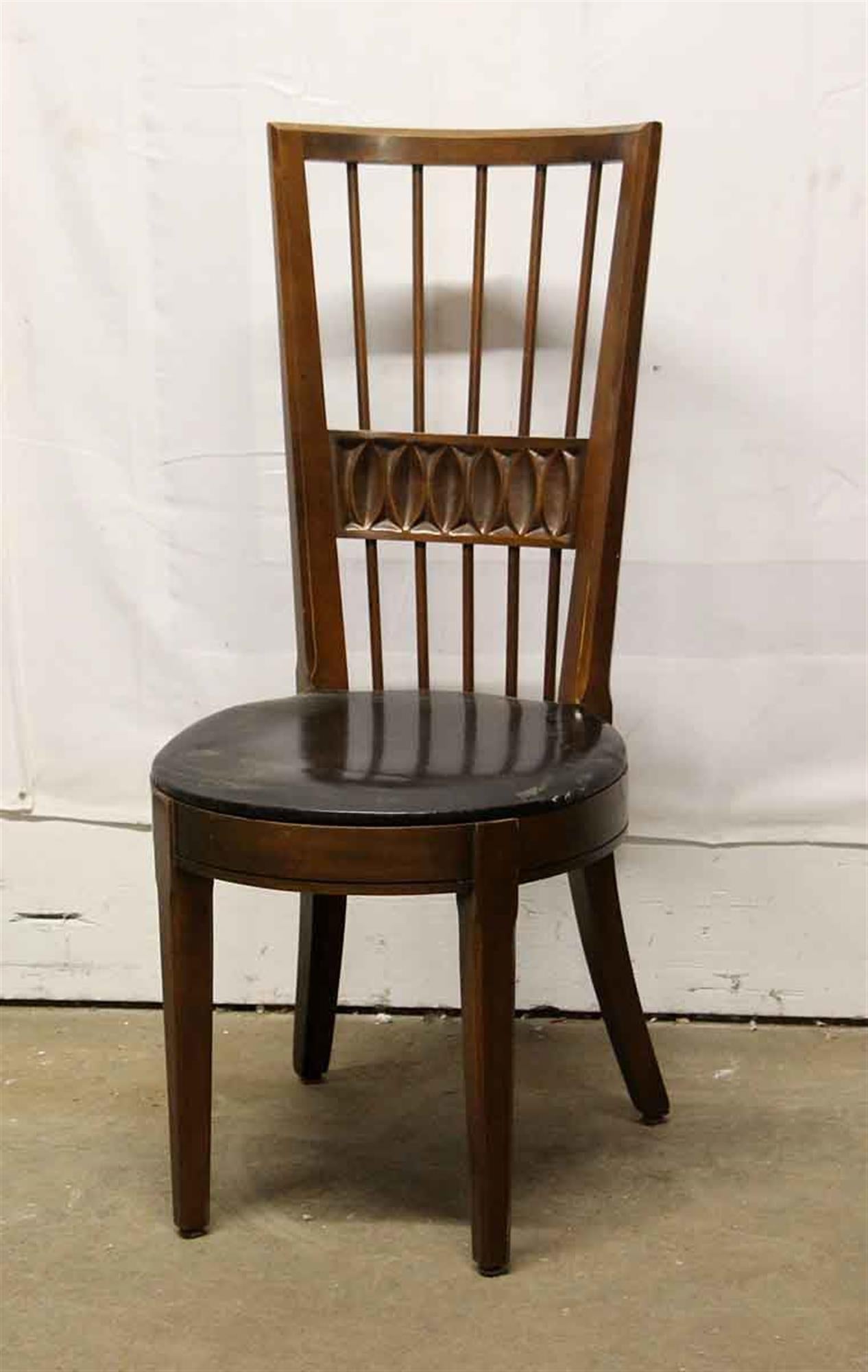 Solid carved wood spindle back Mid-Century Modern dining chairs with a round black vinyl seat from 2001. Made in America by Blowing Rock Furniture of North Carolina. Priced as a set. Please note, this item is located in our Los Angeles, CA location.